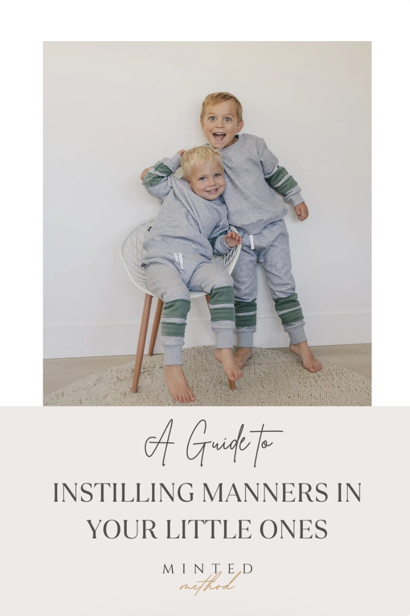 Two children happily posing together, featured in A Guide to Instilling Manners in Your Little Ones.