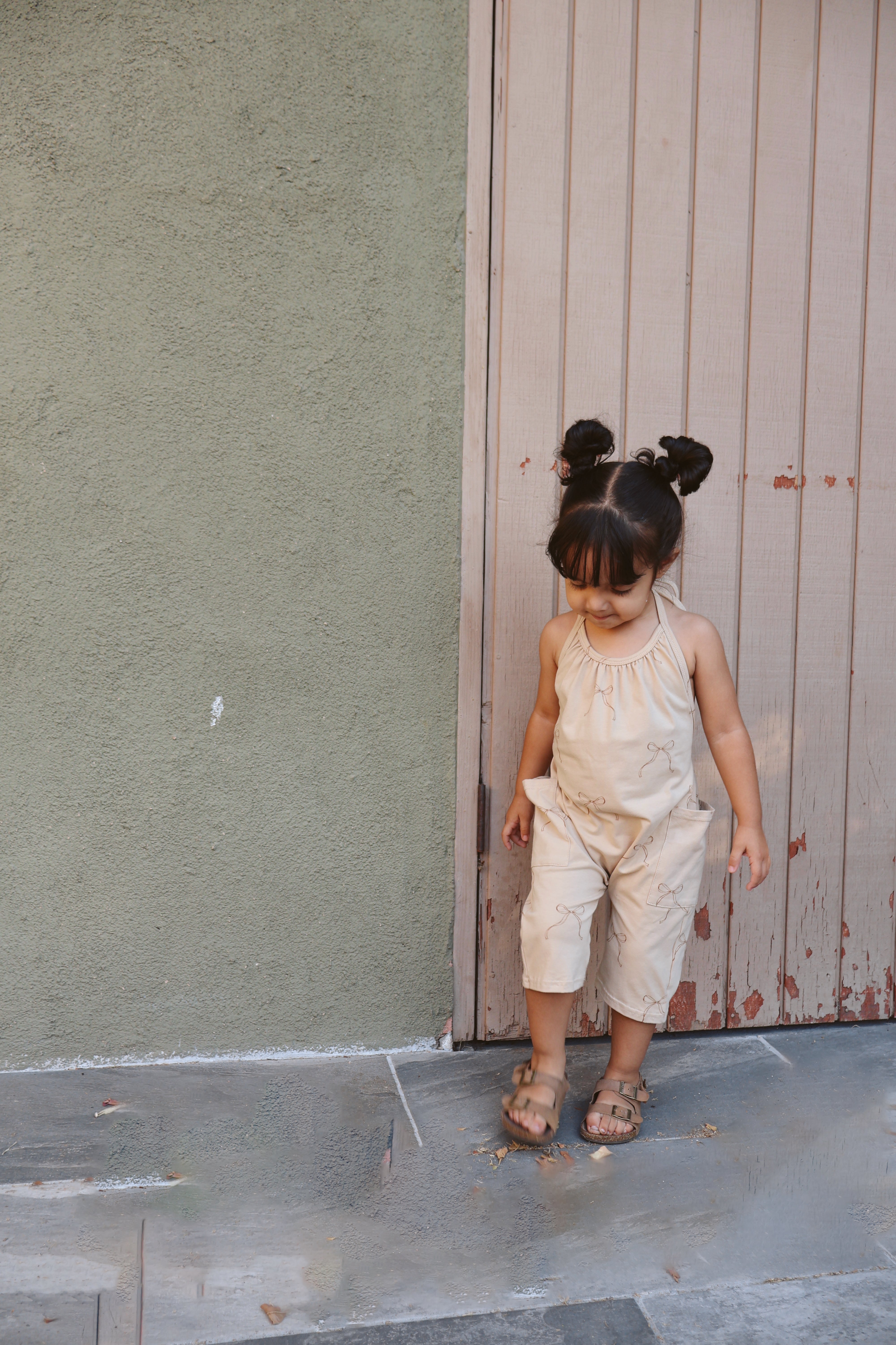Halter jumpsuit girls in light beige, perfect for summer playdates and family outings.
