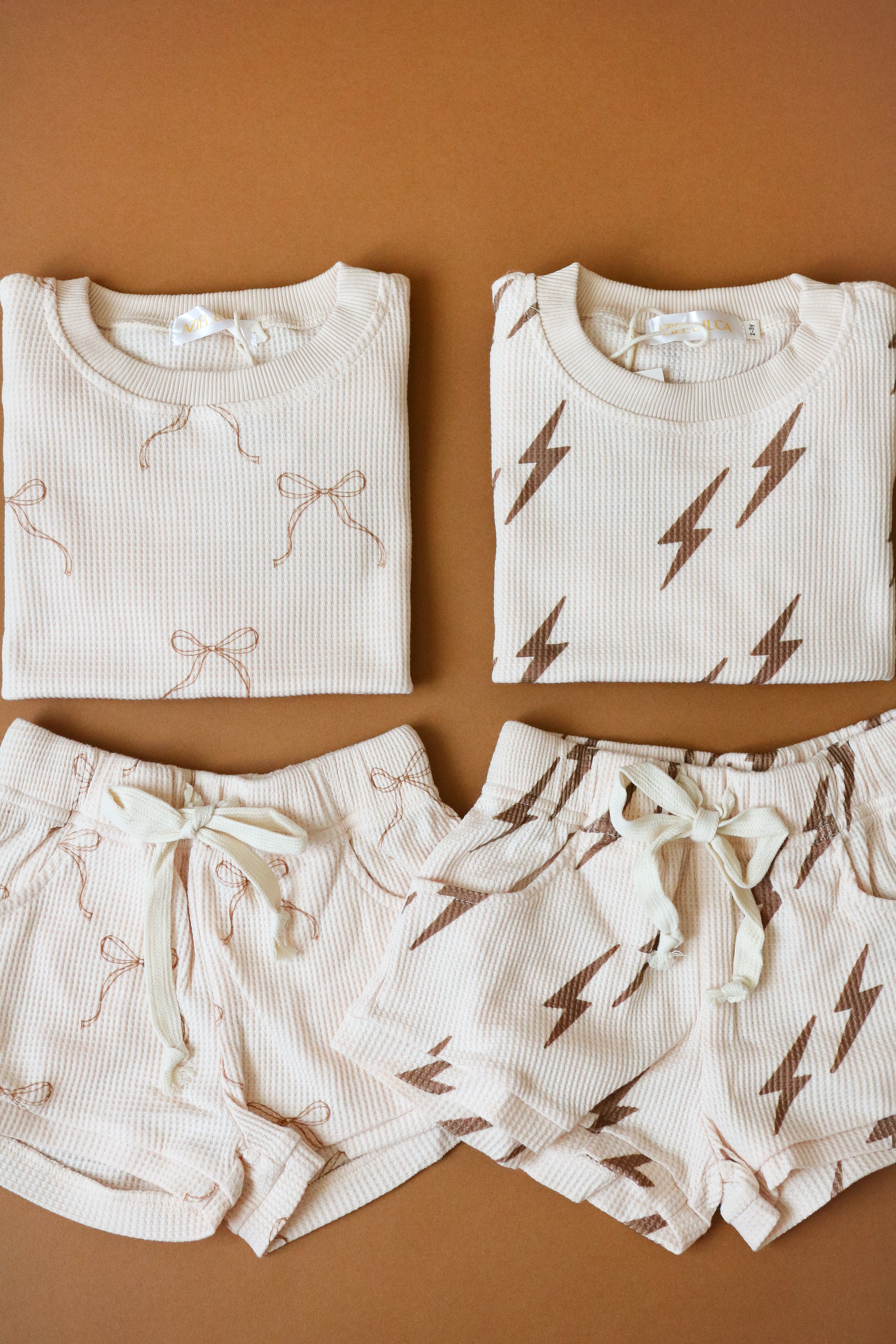 Printed waffle sets for kids featuring Bow and Bolt designs on comfy tee and shorts.