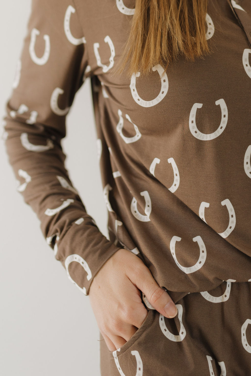 Womens bamboo pajama giddy up set featuring brown horseshoe print and relaxed fit with pockets.