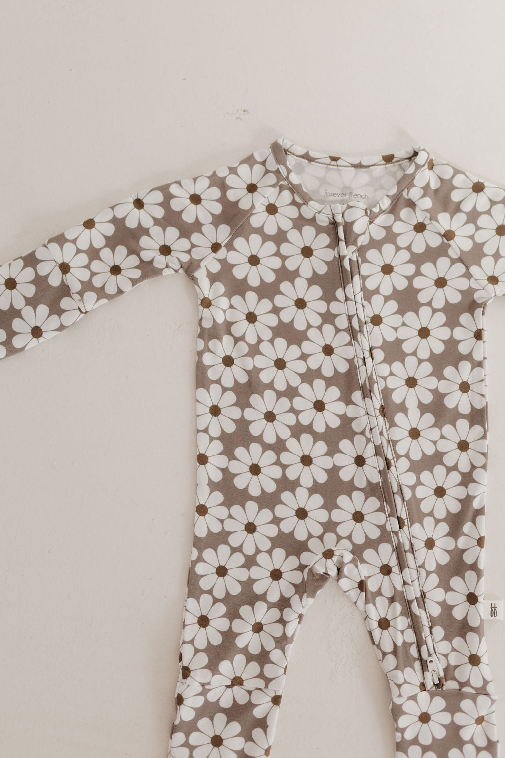 Bamboo zip pajamas darlin' in a brown and white floral print for babies, featuring a double zipper for easy diaper changes.