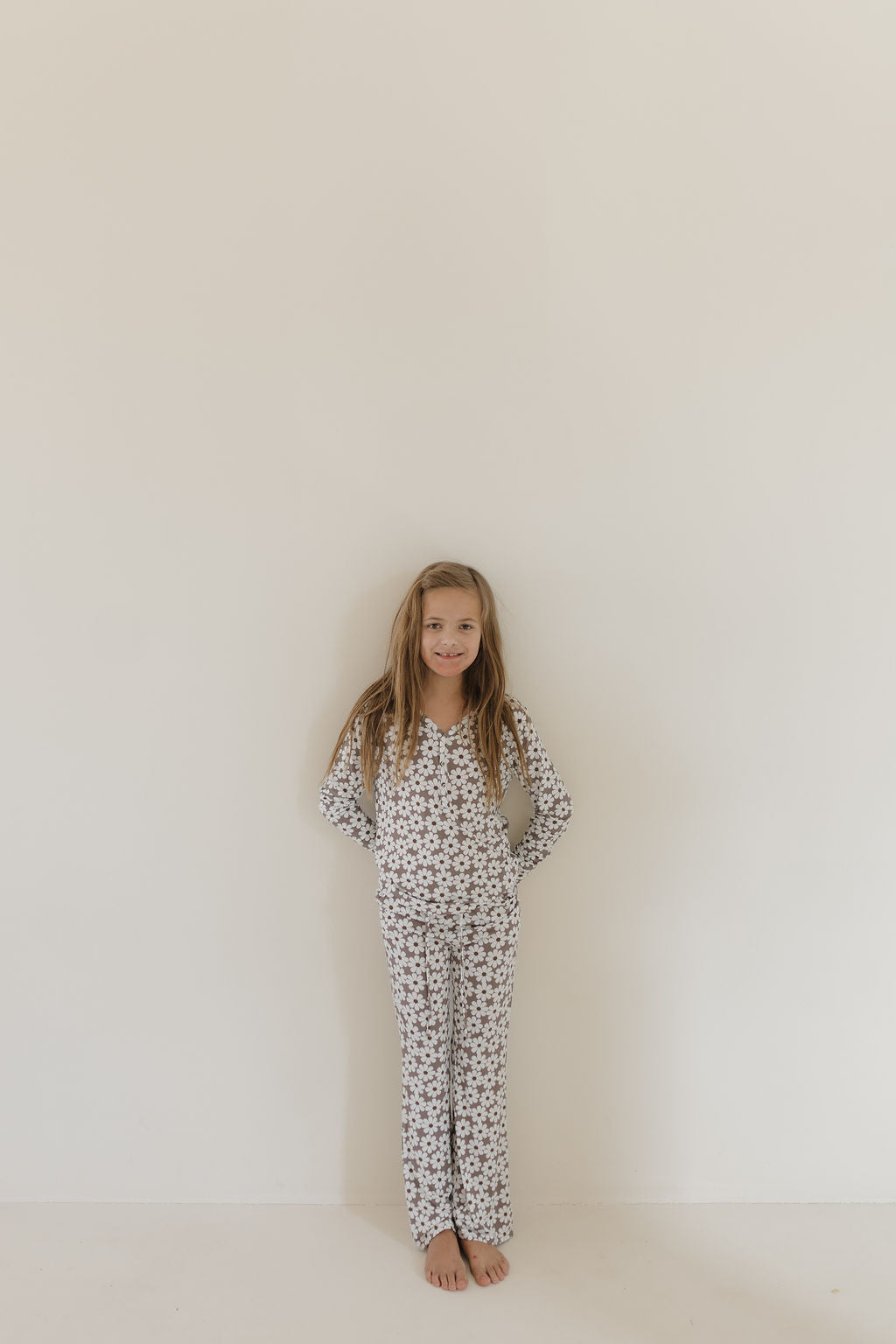 Youth flare bamboo pajamas darlin featuring a girl in floral patterned loungewear against a plain background.