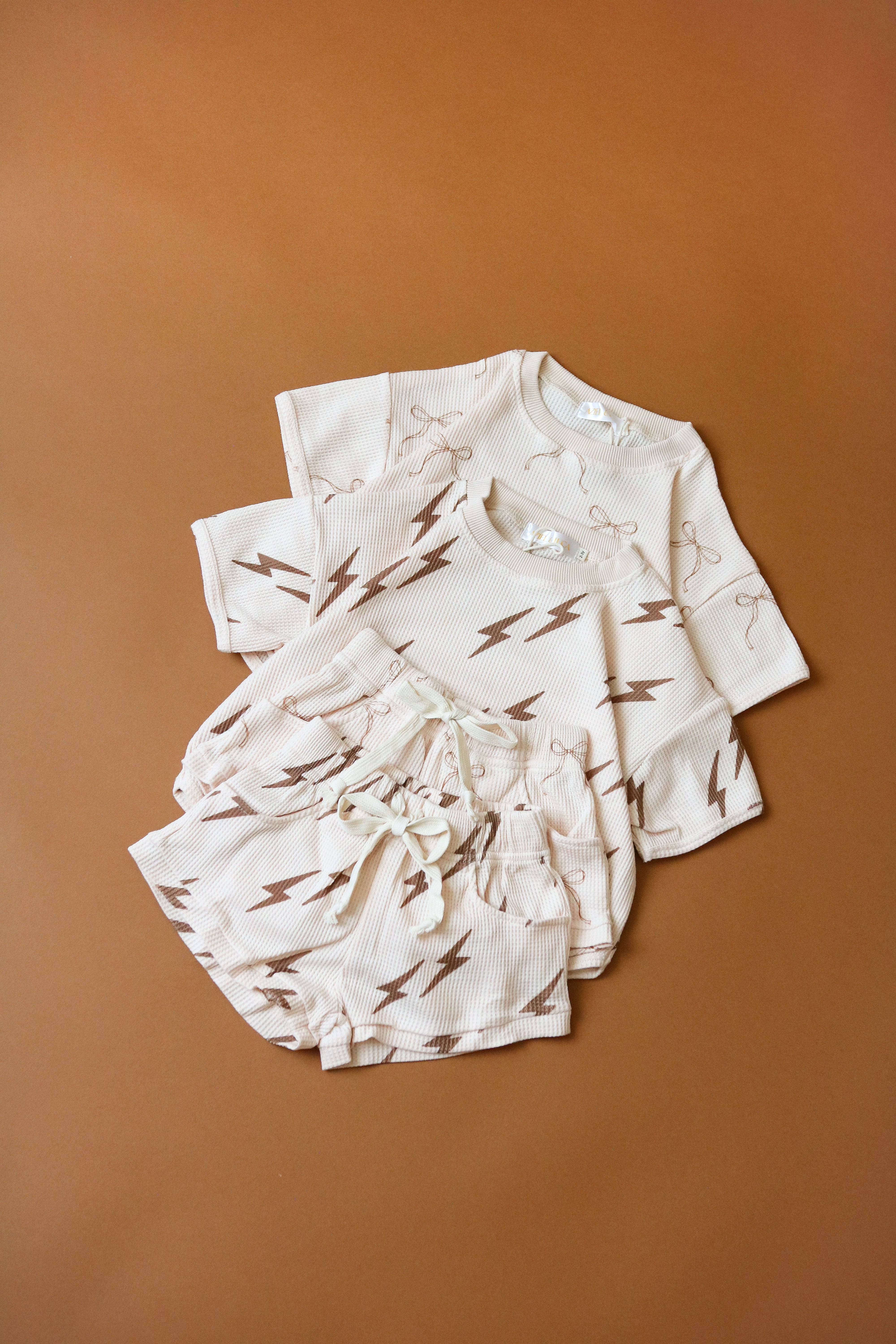 Printed waffle sets for kids featuring lightning bolt prints, perfect for summer fun and comfort.