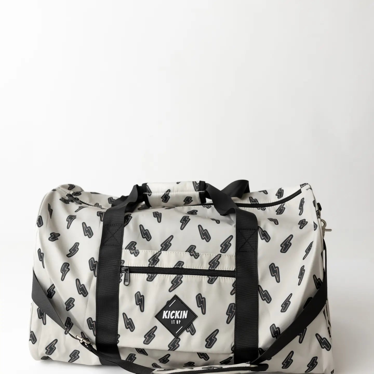 Sand Thunderbolt Weekender bag featuring a stylish lightning bolt design and sturdy black straps.
