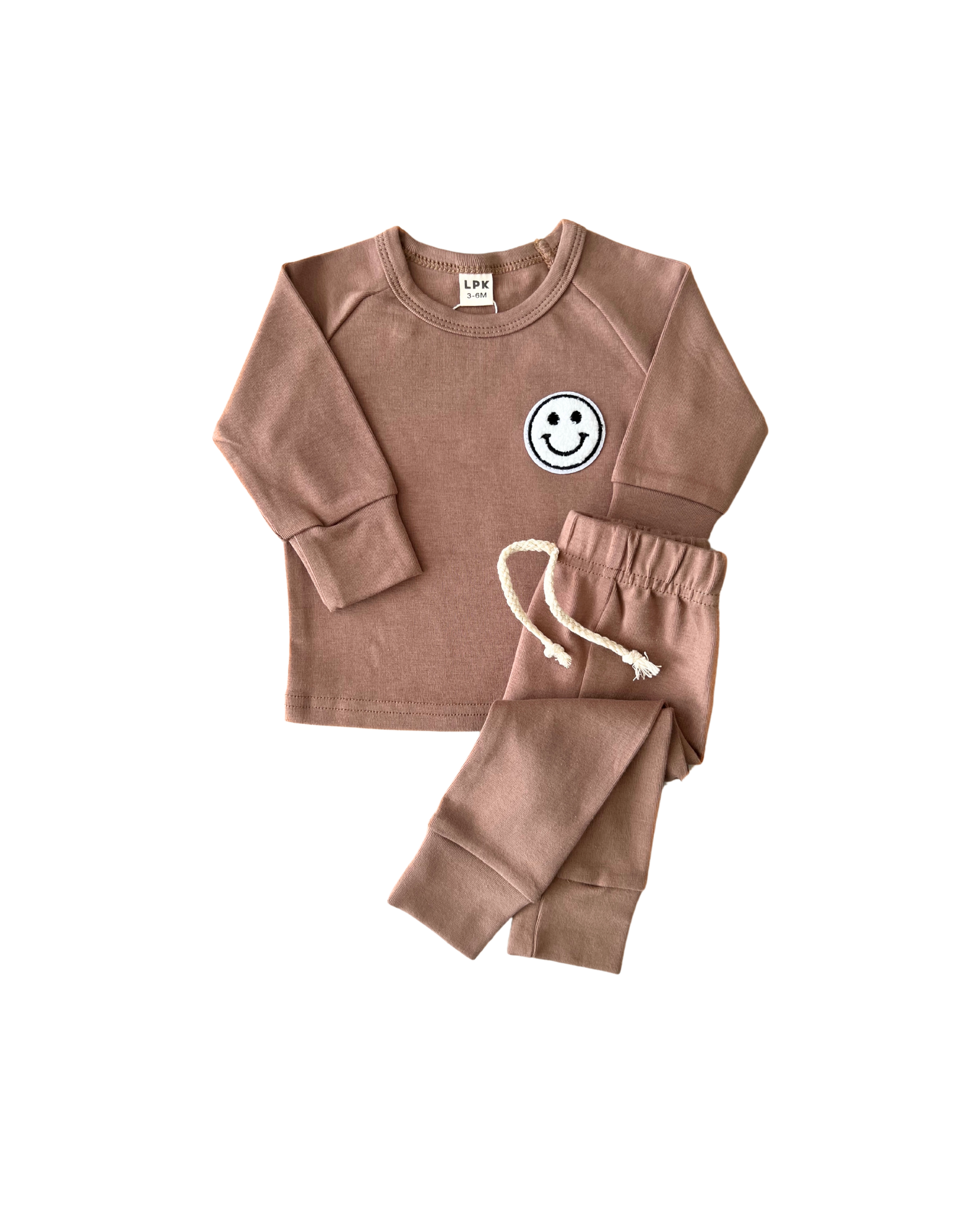 Lounge set smiley mocha for kids featuring soft tee and comfy shorts with a playful smiley patch.