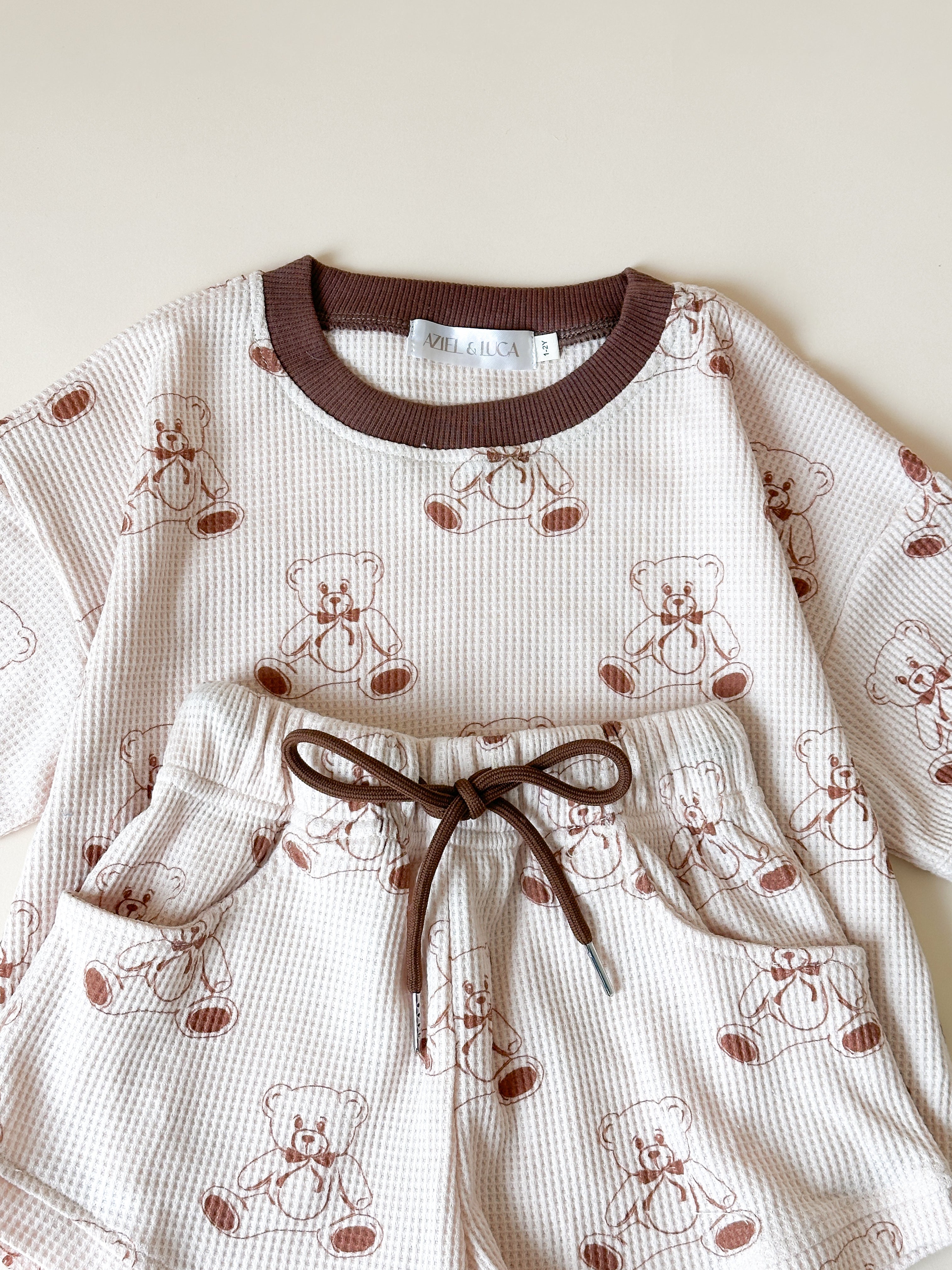 Printed waffle sets kids featuring a cozy teddy bear design tee and shorts in soft, breathable fabric.
