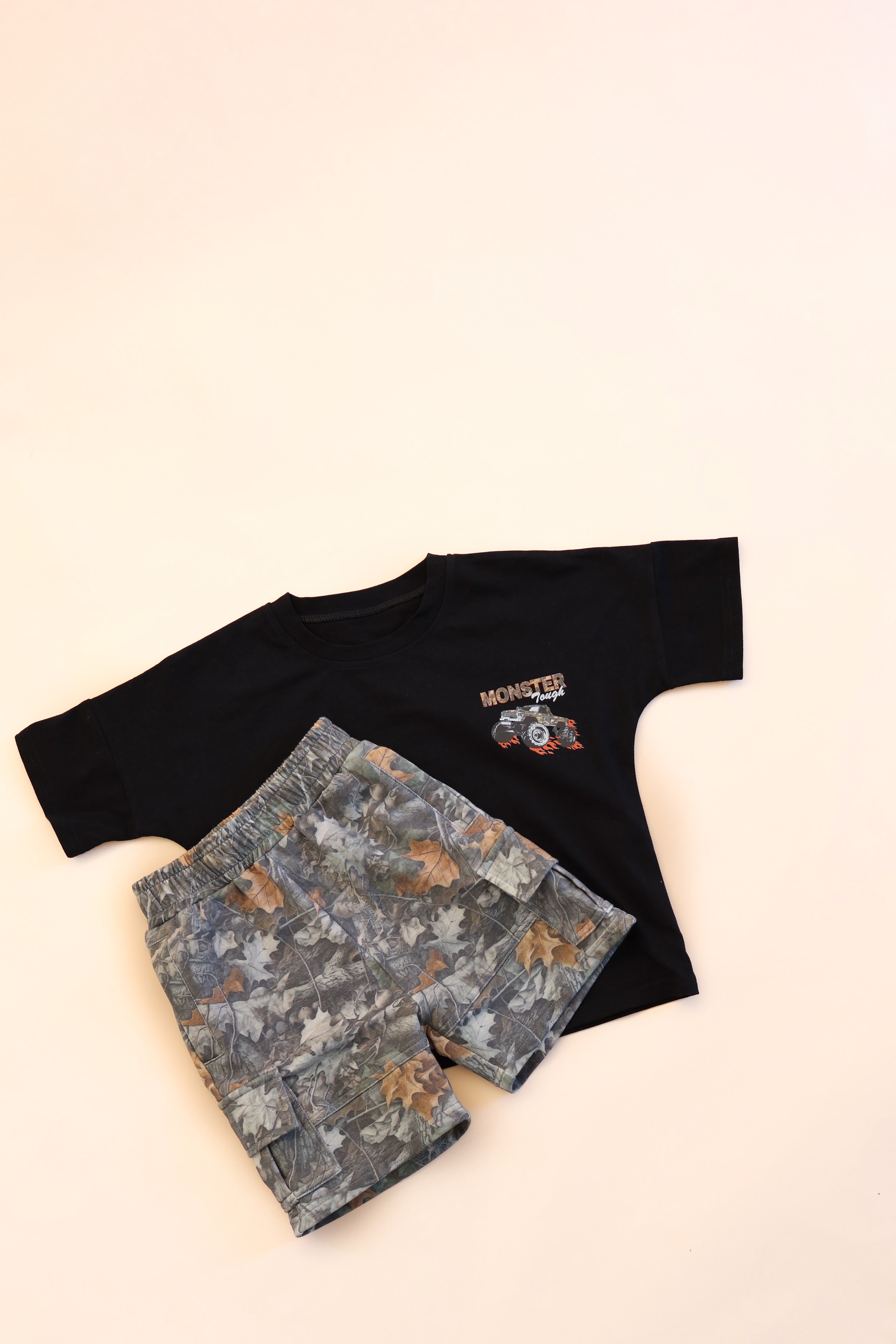 Leaf camo cargo shorts kids with a black t-shirt, perfect for active toddlers aged 3 months to 6 years.