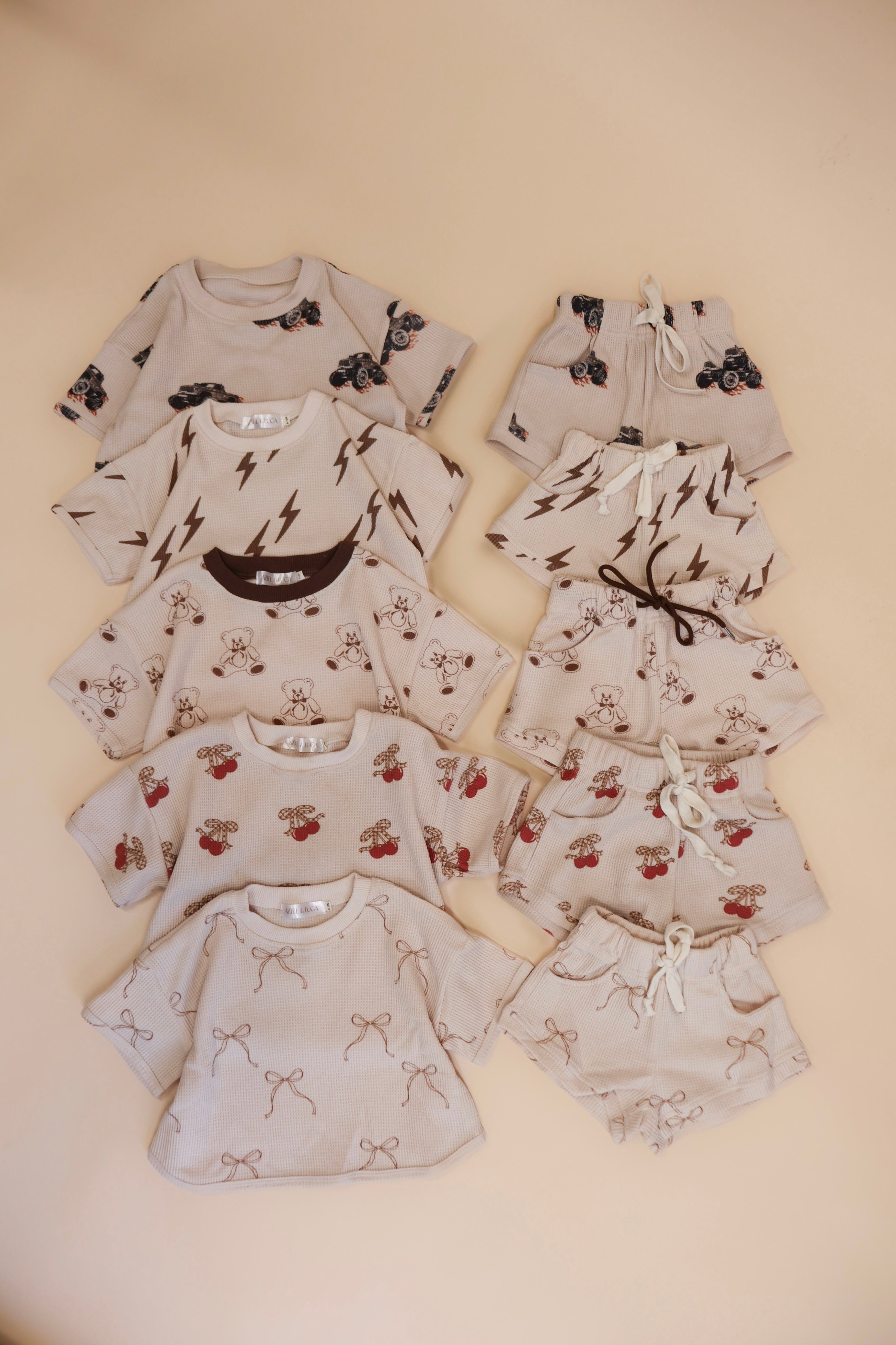 Printed waffle sets for kids featuring fun designs like Monster Truck, Lightning, Cherry, Bow, and Bear.
