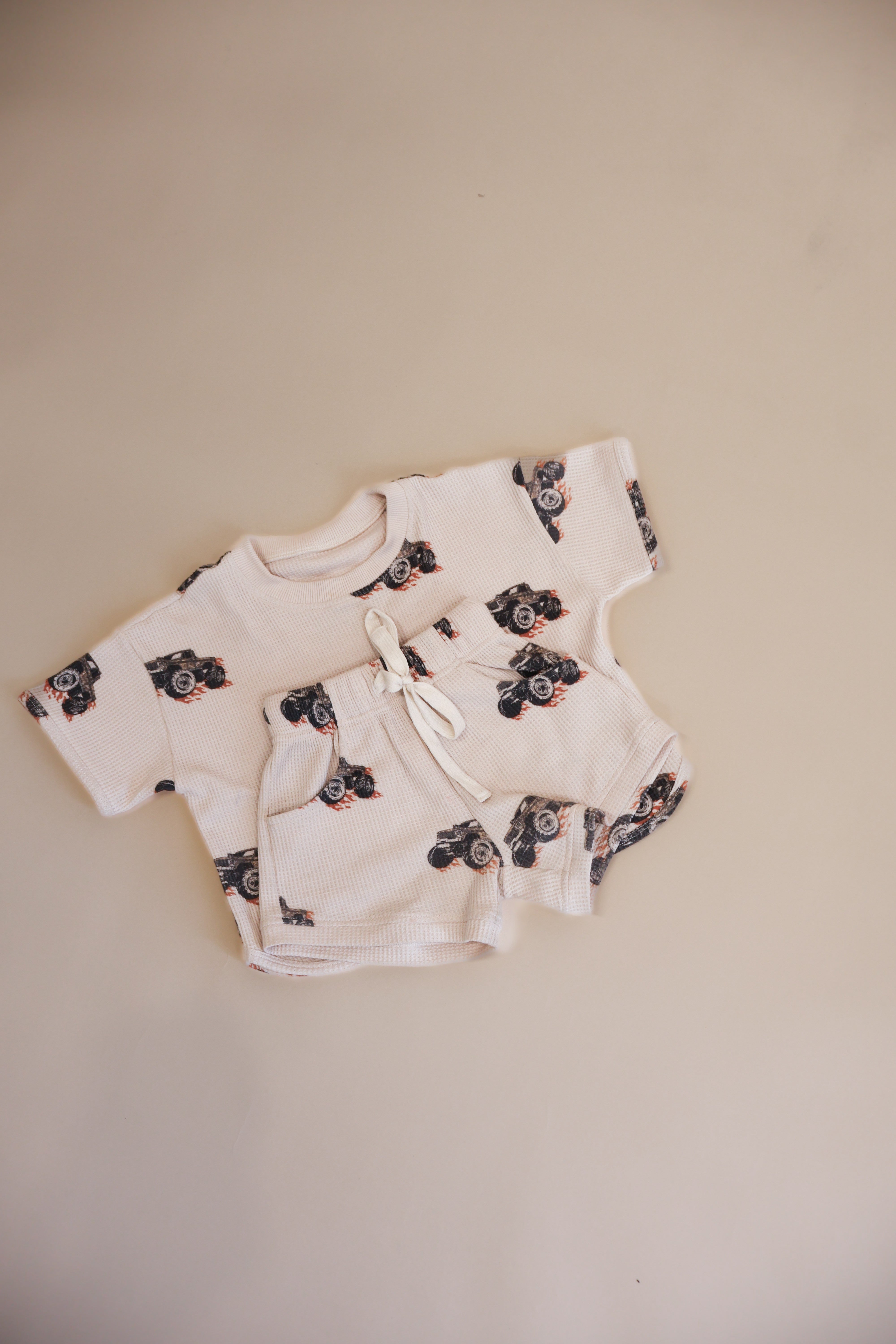 Printed waffle sets kids featuring a cute Monster Truck design, perfect for summer play and comfort.