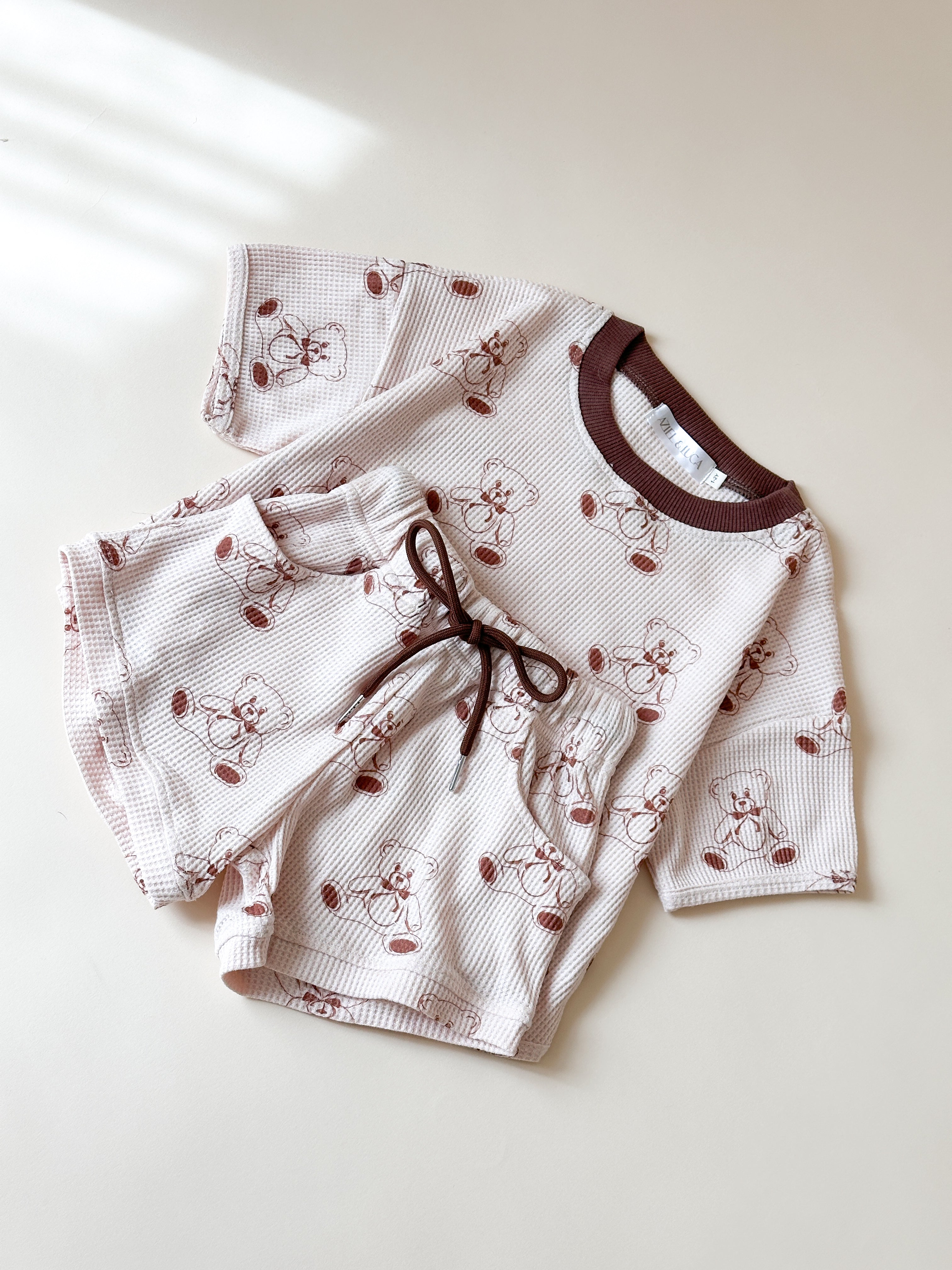 Printed waffle sets for kids featuring a playful cherry design in a comfy tee and shorts style.