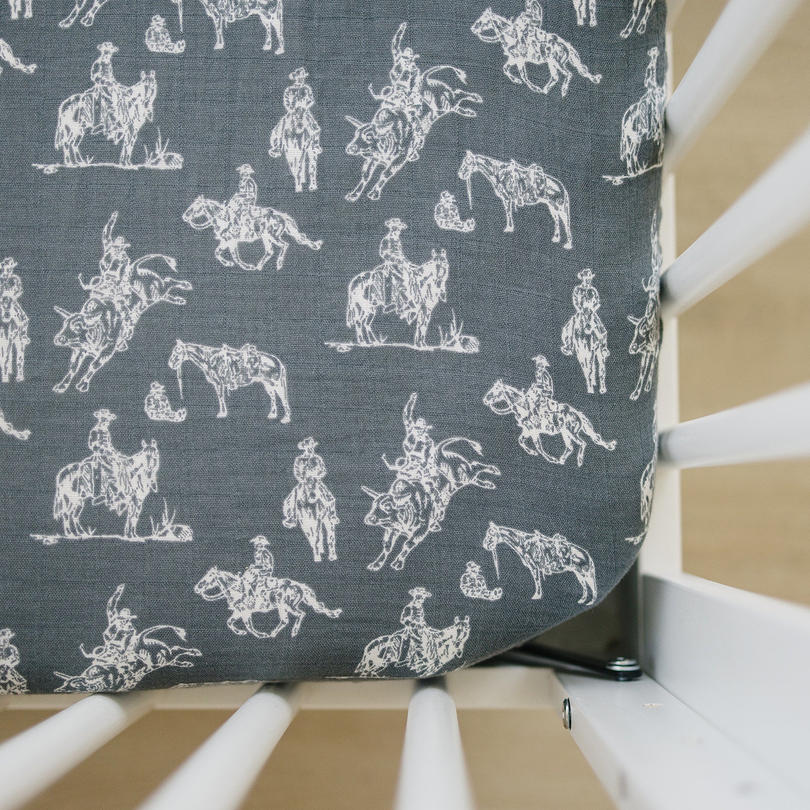Muslin Crib Sheet featuring cowboy and western patterns on a fitted crib sheet, perfect for a rustic nursery.