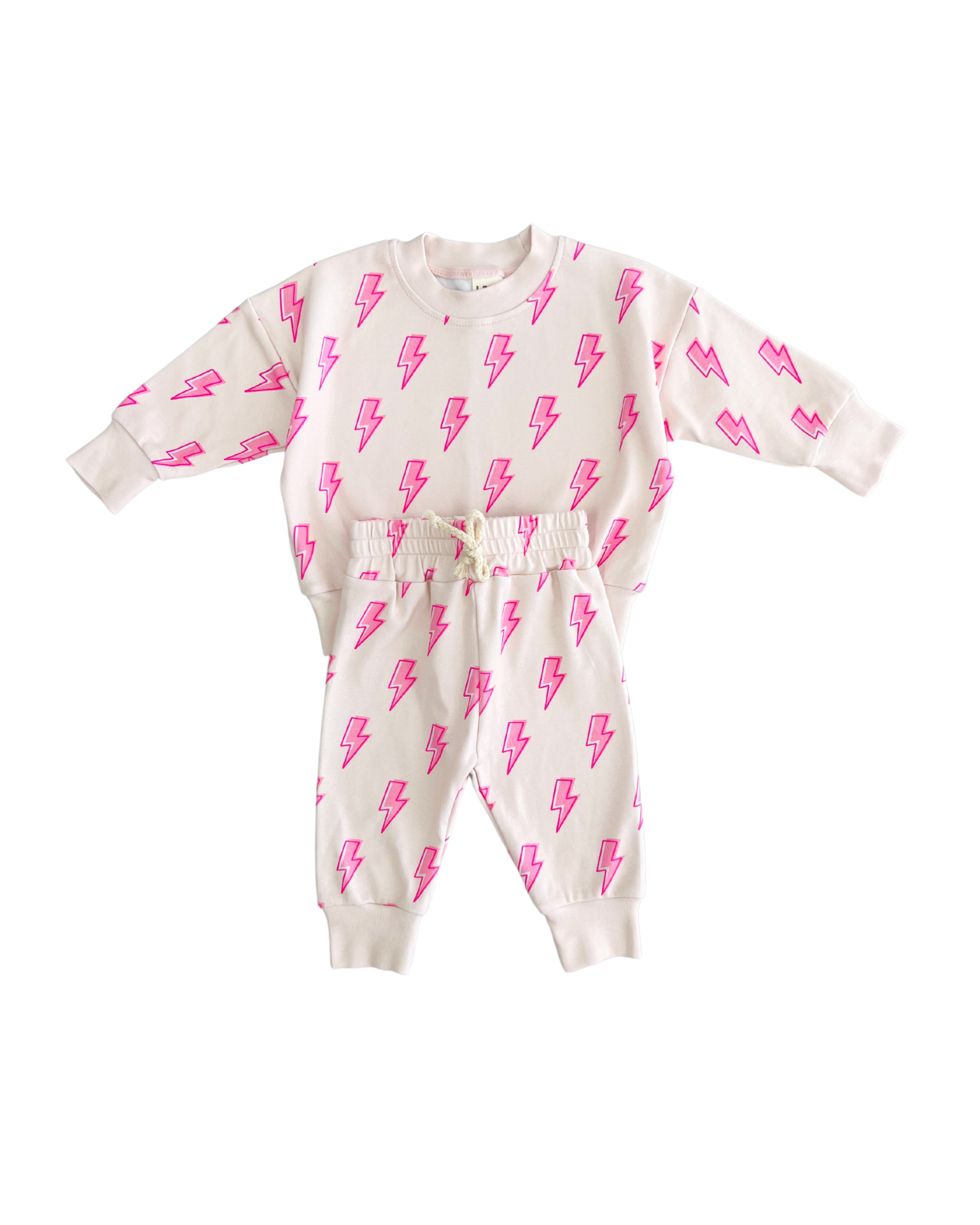 Pink bolt jogger set for toddlers featuring a soft cotton blend and fun lightning bolt print.