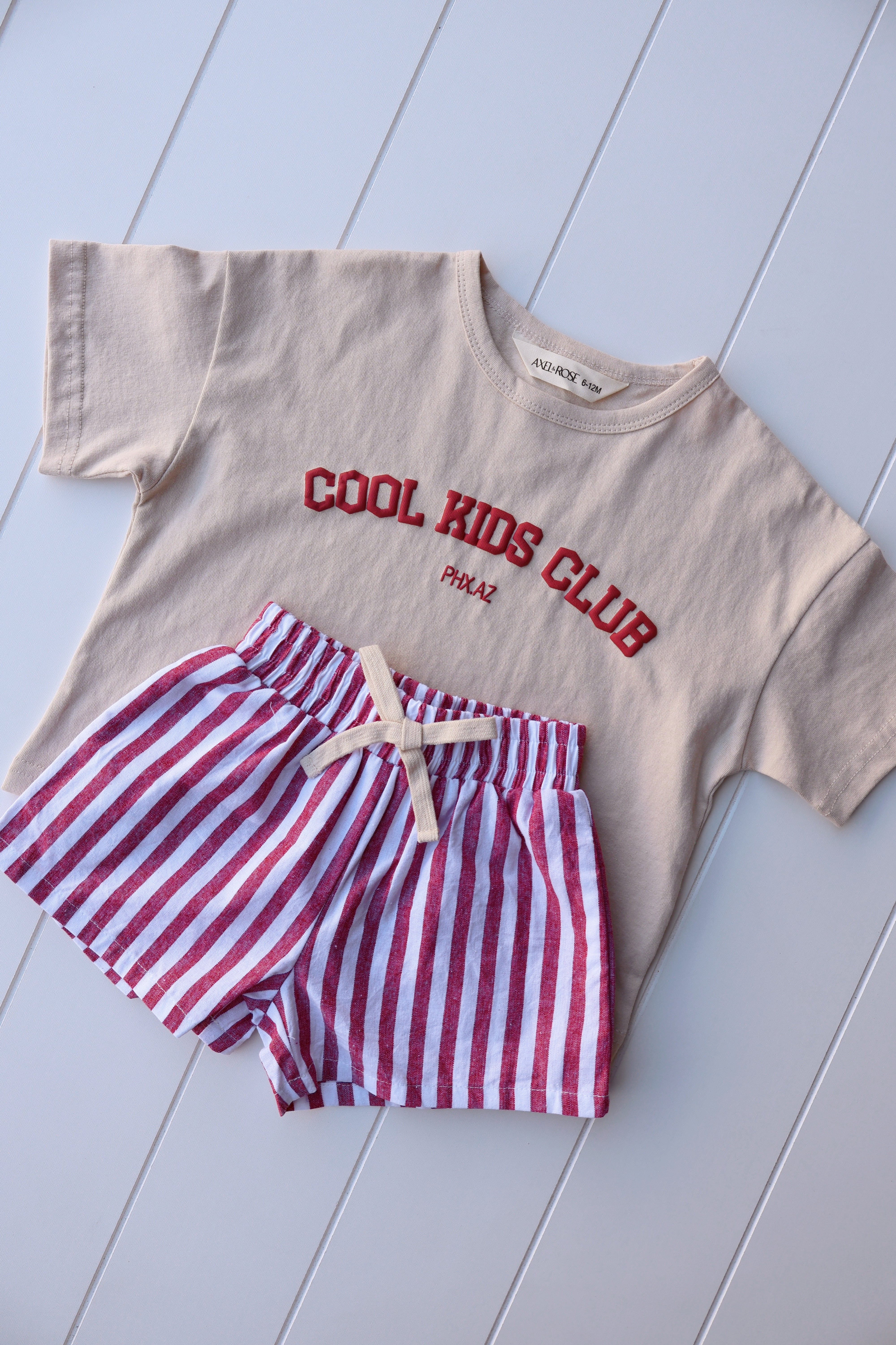 Vintage stripe shorts for toddlers paired with a graphic tee, ideal for warm weather and playful outings.
