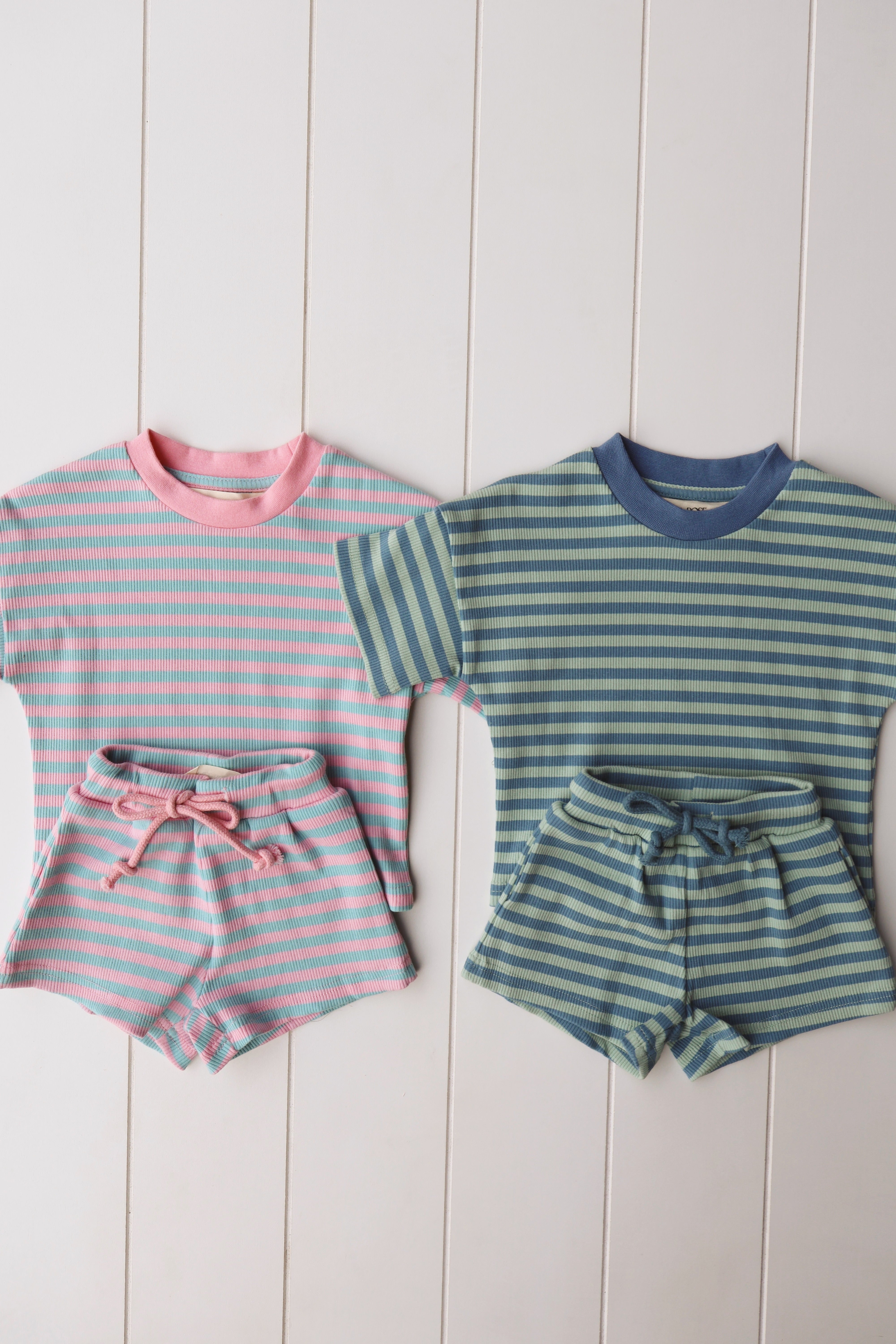 Cotton candy two-piece short set featuring pastel striped tops and shorts for toddlers and kids.