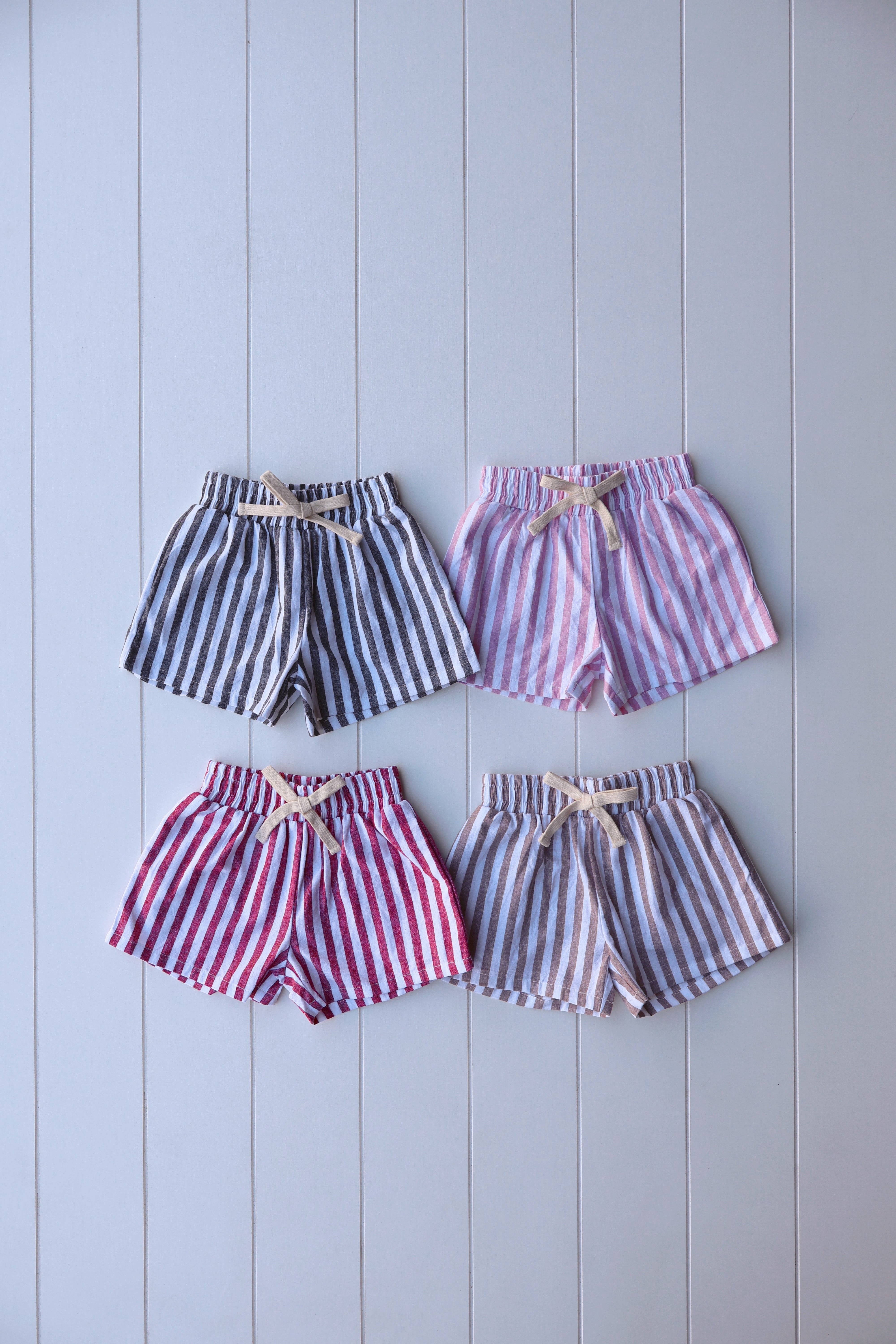 Vintage stripe shorts for toddlers in various colors, perfect for warm days and casual outings.