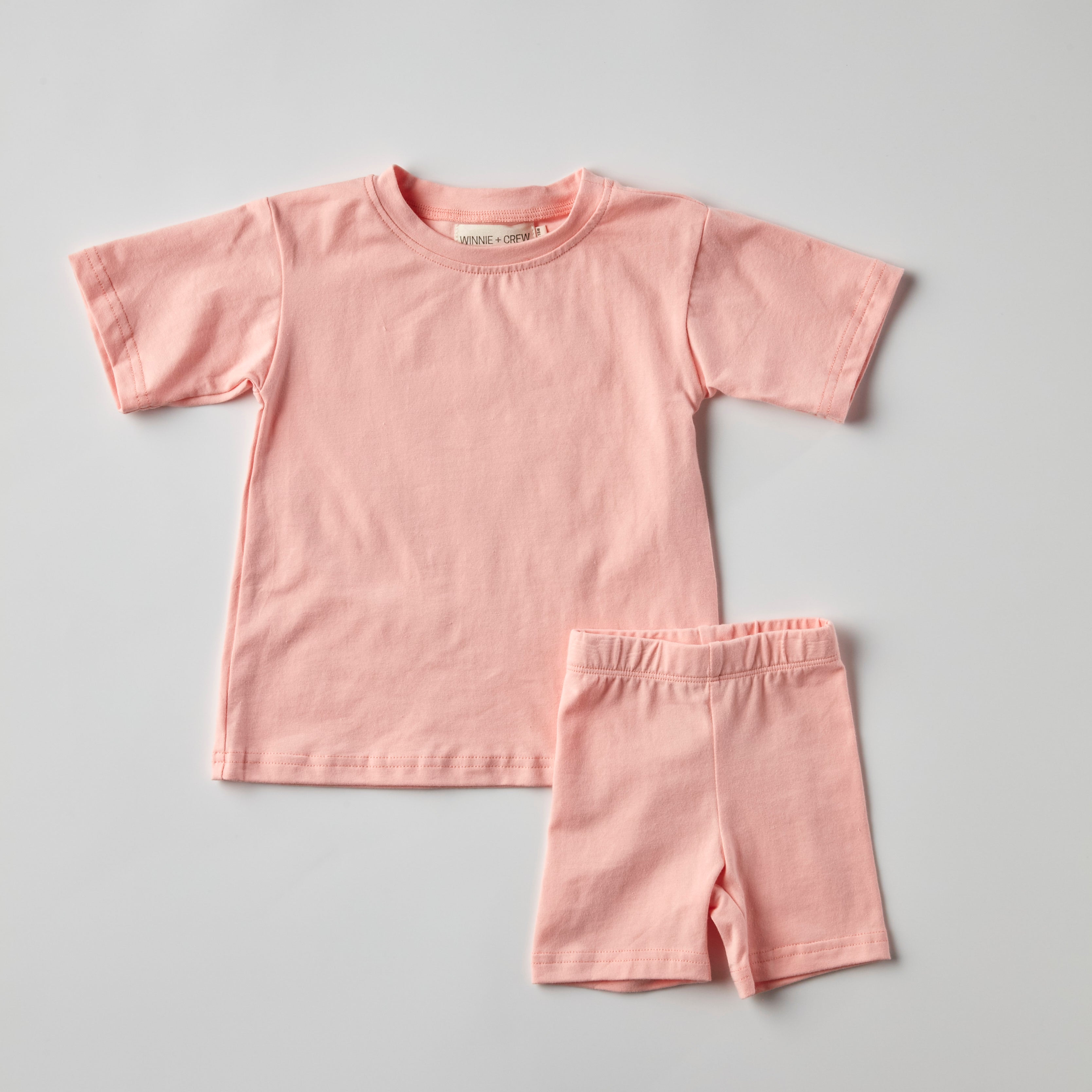 Indy Set in pink featuring an oversized T-shirt and bike shorts for stylish comfort.