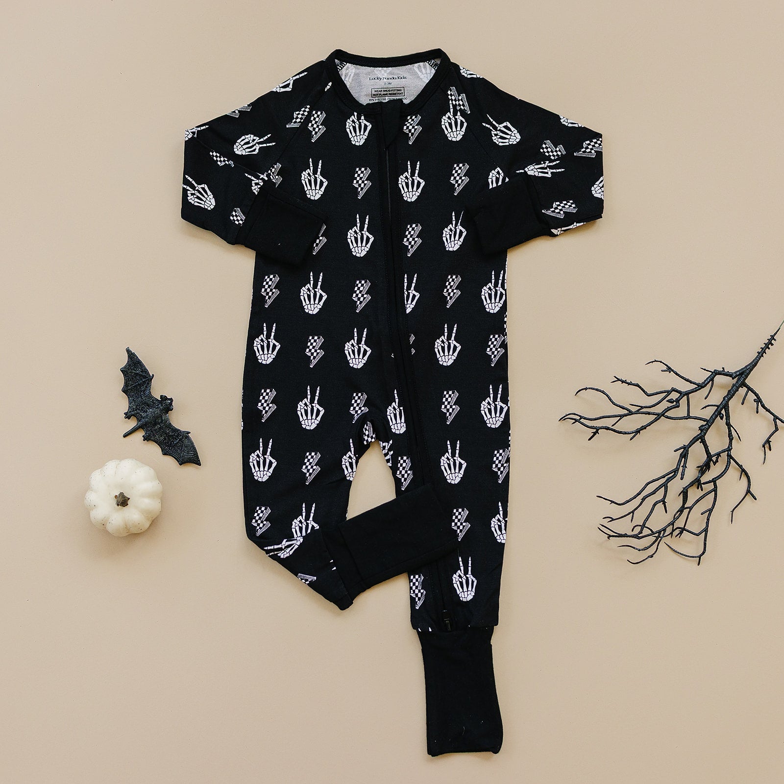 Bamboo Zip Romper Skelly Vibes in black with skeleton graphics, perfect for cozy Halloween sleepwear.