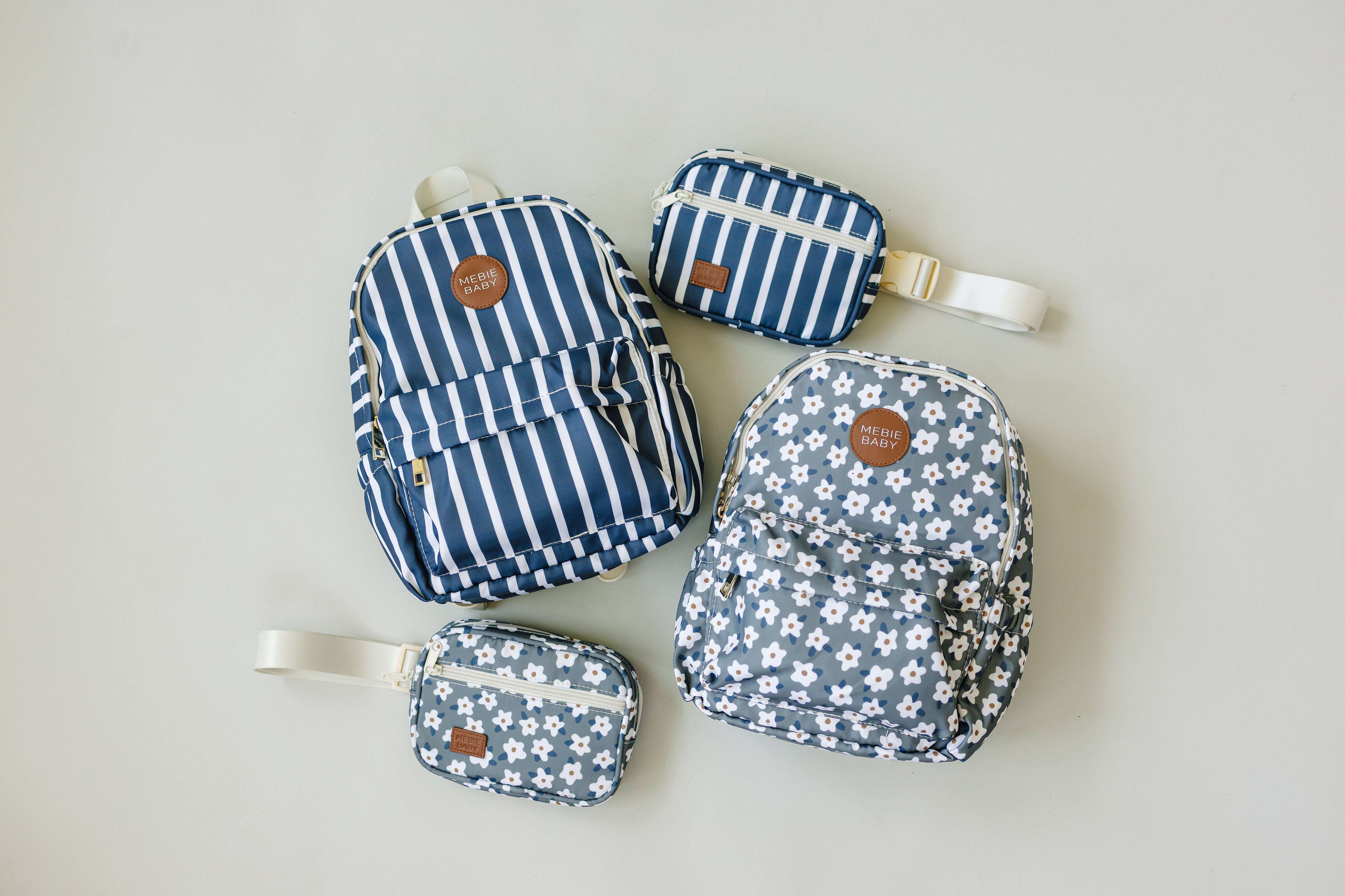 Variety of stylish kids mini backpacks and pouches in navy stripes and floral designs, perfect for school and outings.