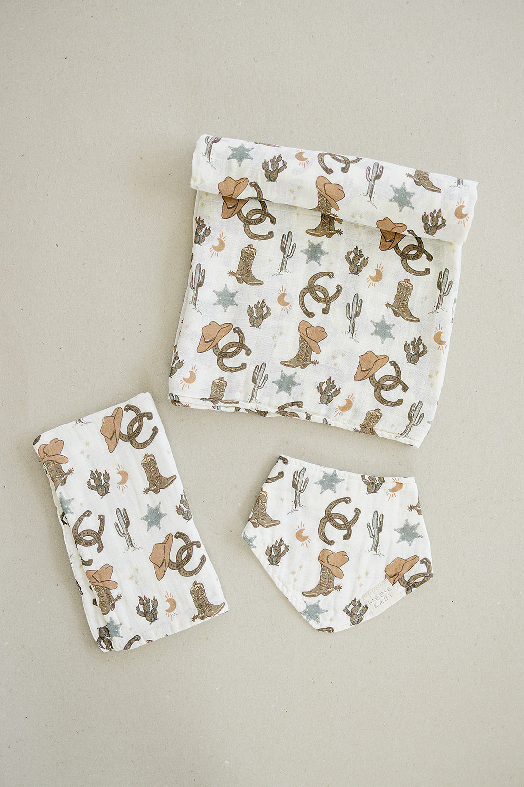 Outlaw Cowboy Classic Muslin Bib set featuring cute western prints, perfect for keeping baby stylish and clean during meals.
