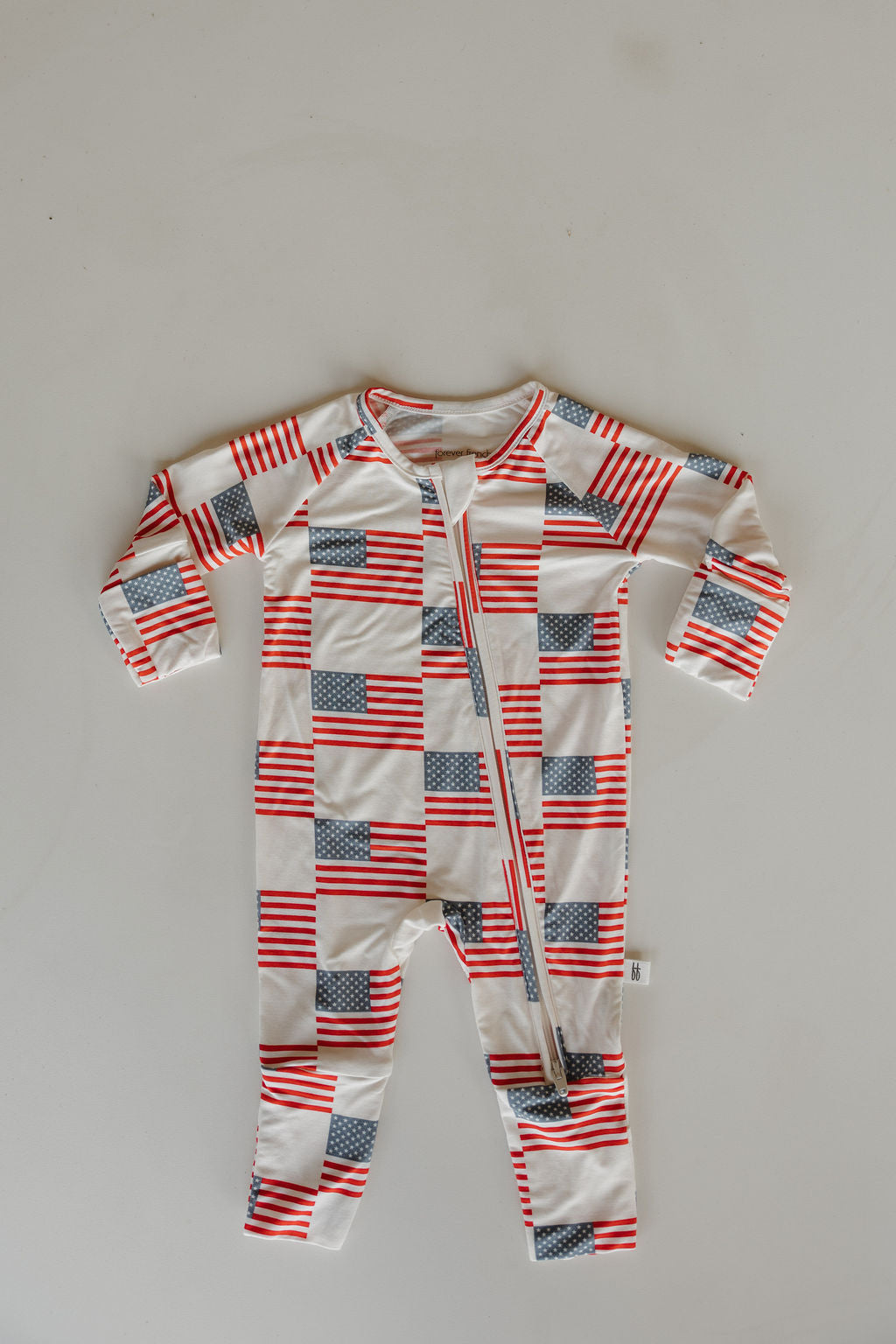 Bamboo zip pajamas featuring Americana print with red, white, and blue stars and stripes, ideal for summer and holidays.
