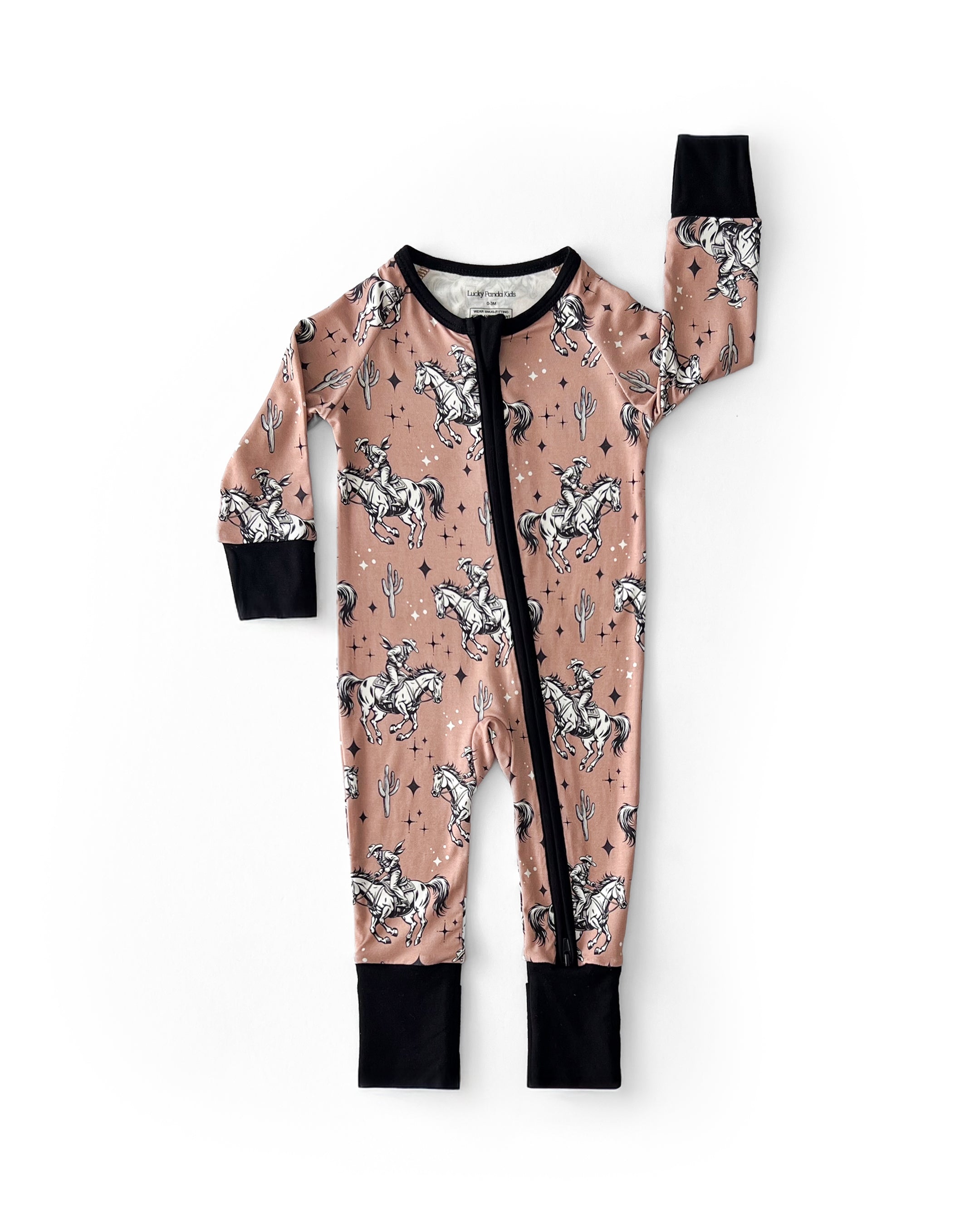 Bamboo zip romper for babies in dusty desert color with cowboy print, featuring a double zipper for easy changes.
