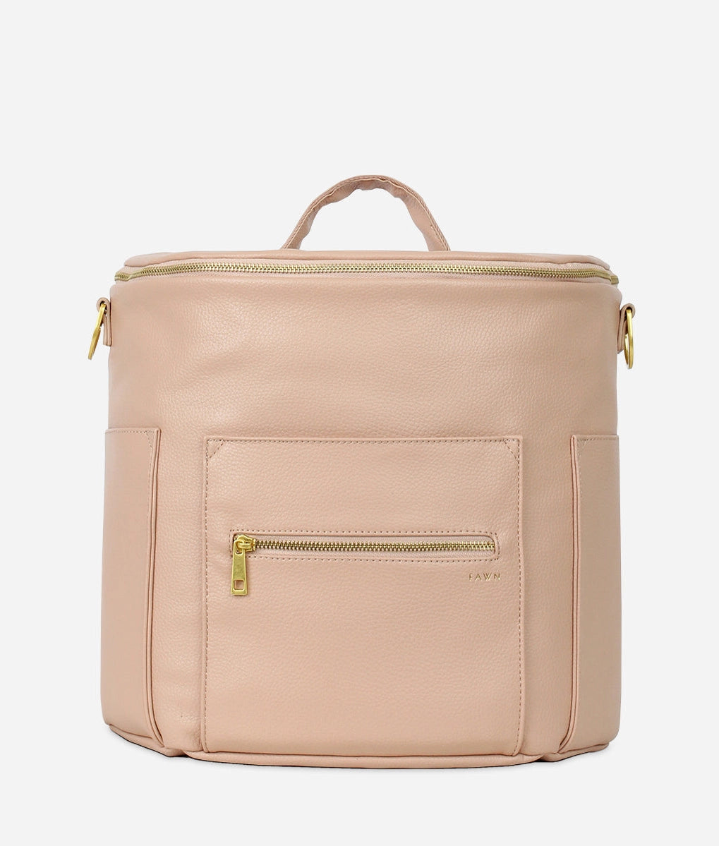 Original Diaper Bag Backpack in warm blush faux leather, featuring organized pockets for baby essentials.
