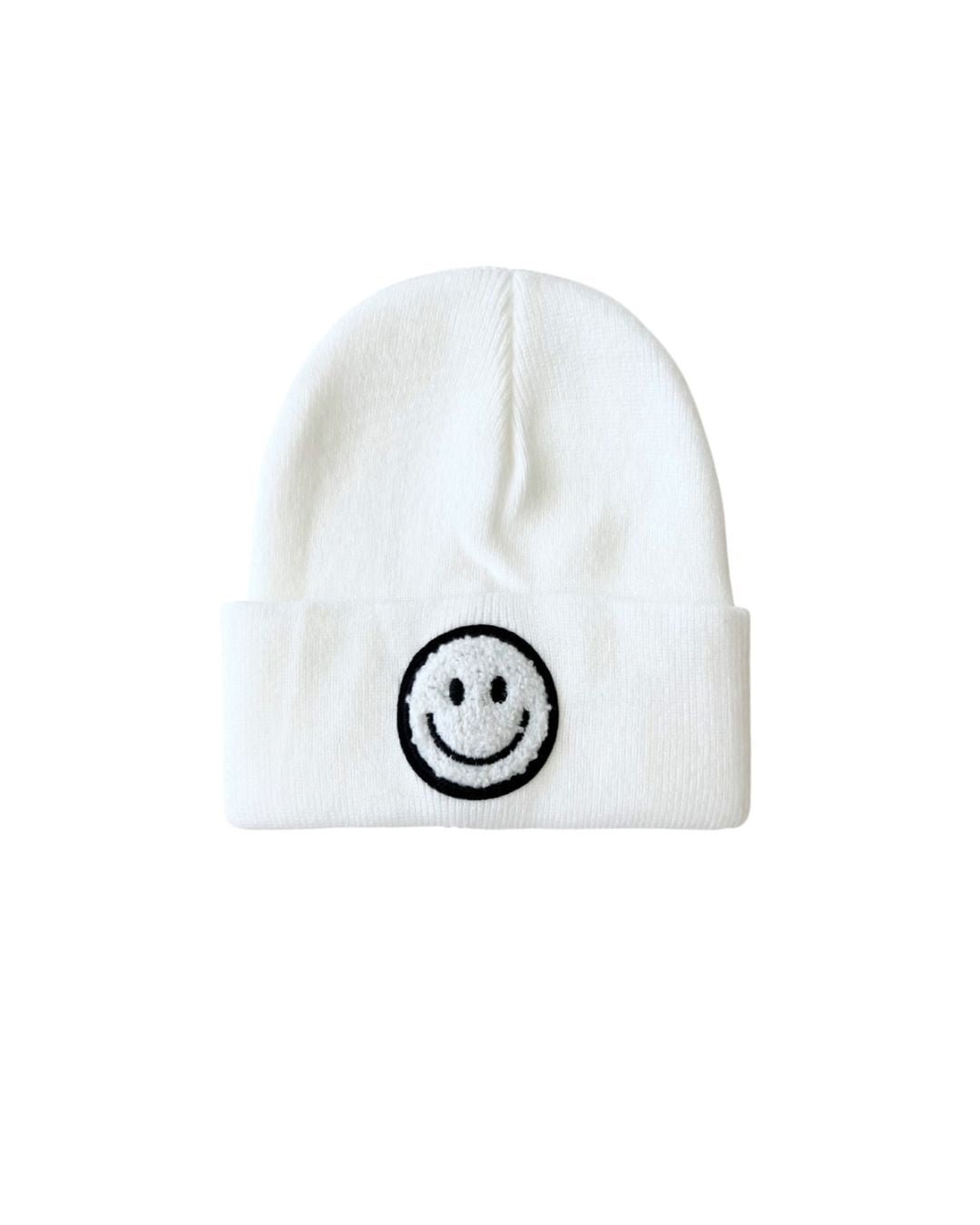 Smiley Beanie in white with a black smiley face, made from soft stretchy acrylic for cozy cold-weather wear.