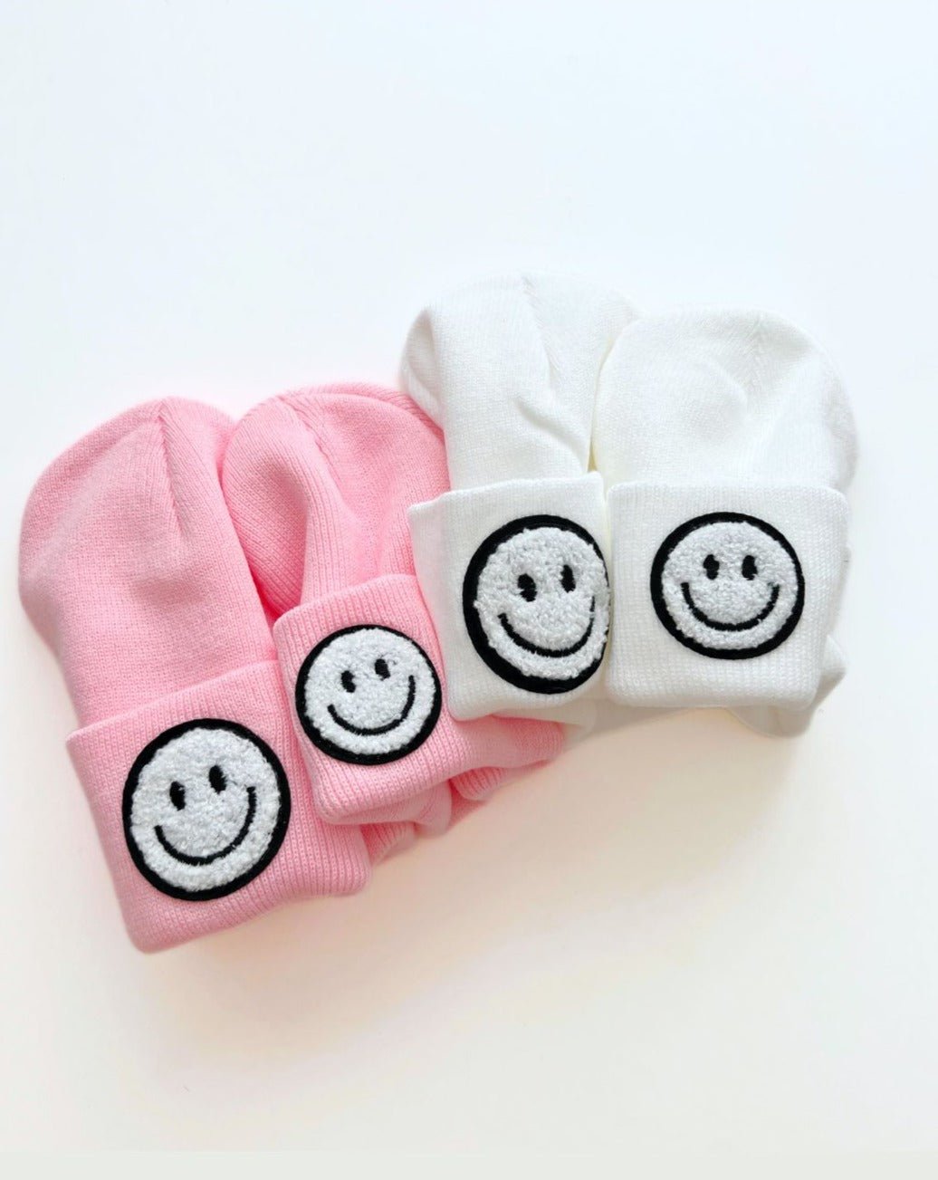 Smiley Beanie set in pink and white featuring embroidered smiley faces for kids.