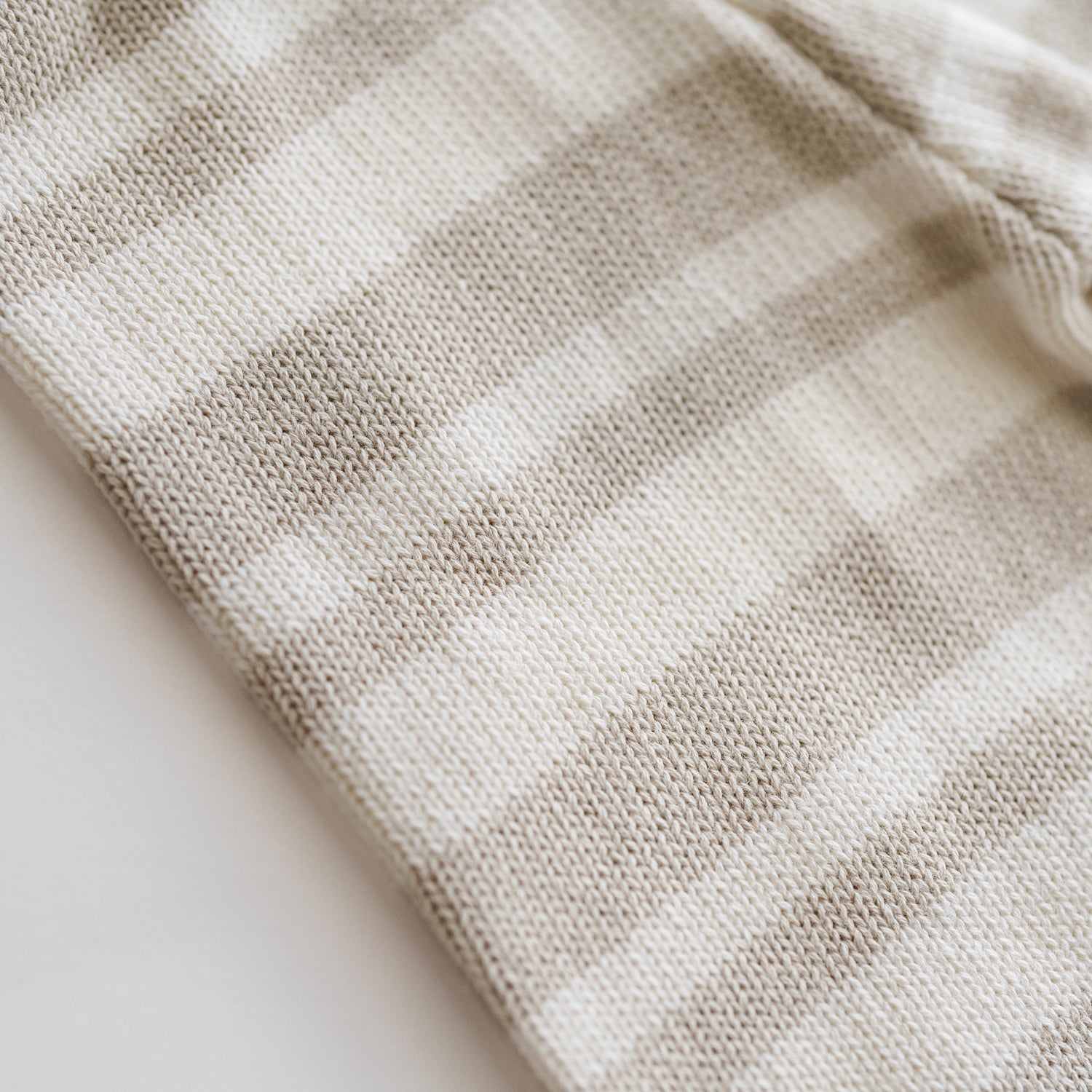 Close-up of the Organic Knit Wideleg Pant texture with earthy striped patterns, perfect for babies and toddlers.