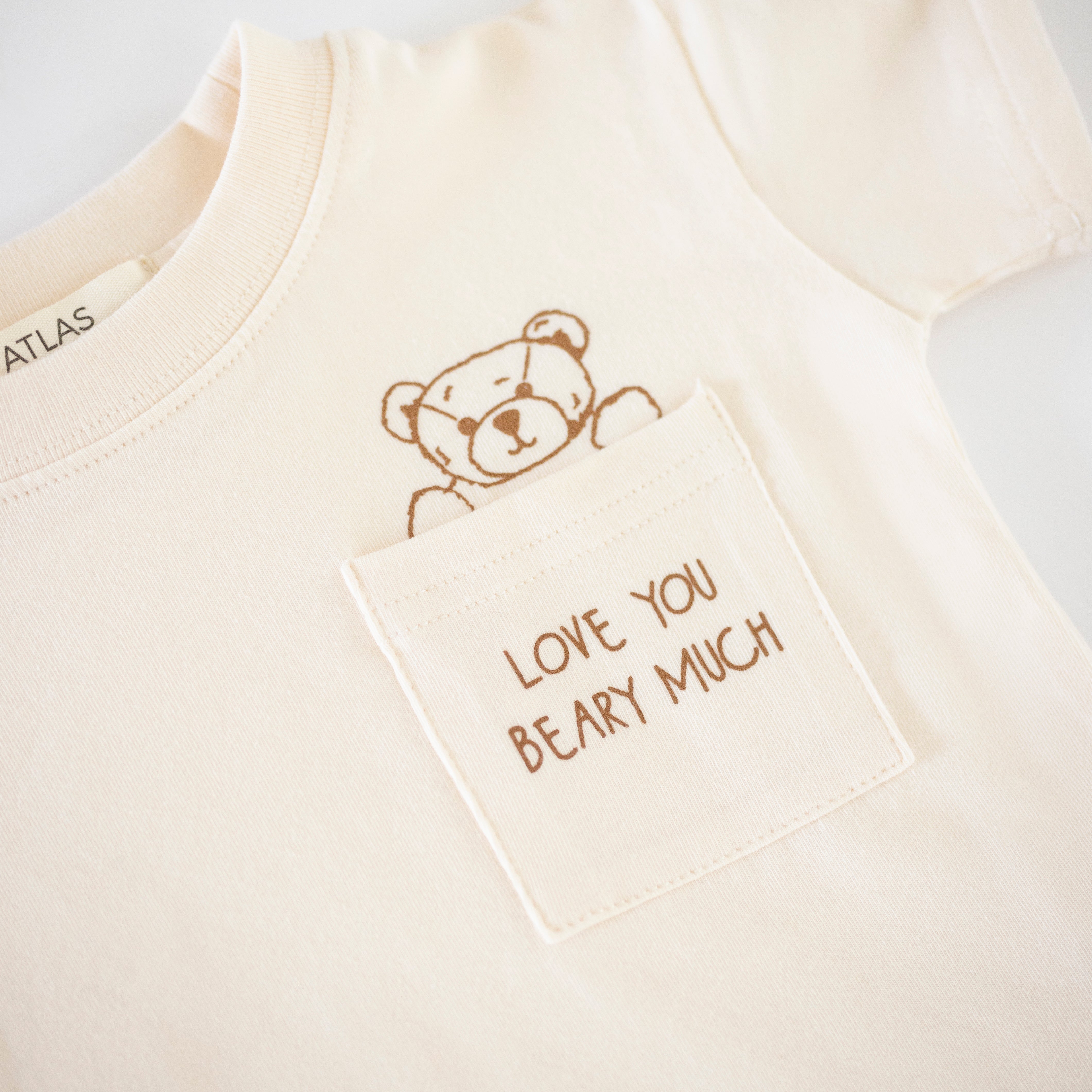 Love You Beary Much Tee with a cute bear graphic on the pocket for a cozy baby t-shirt.