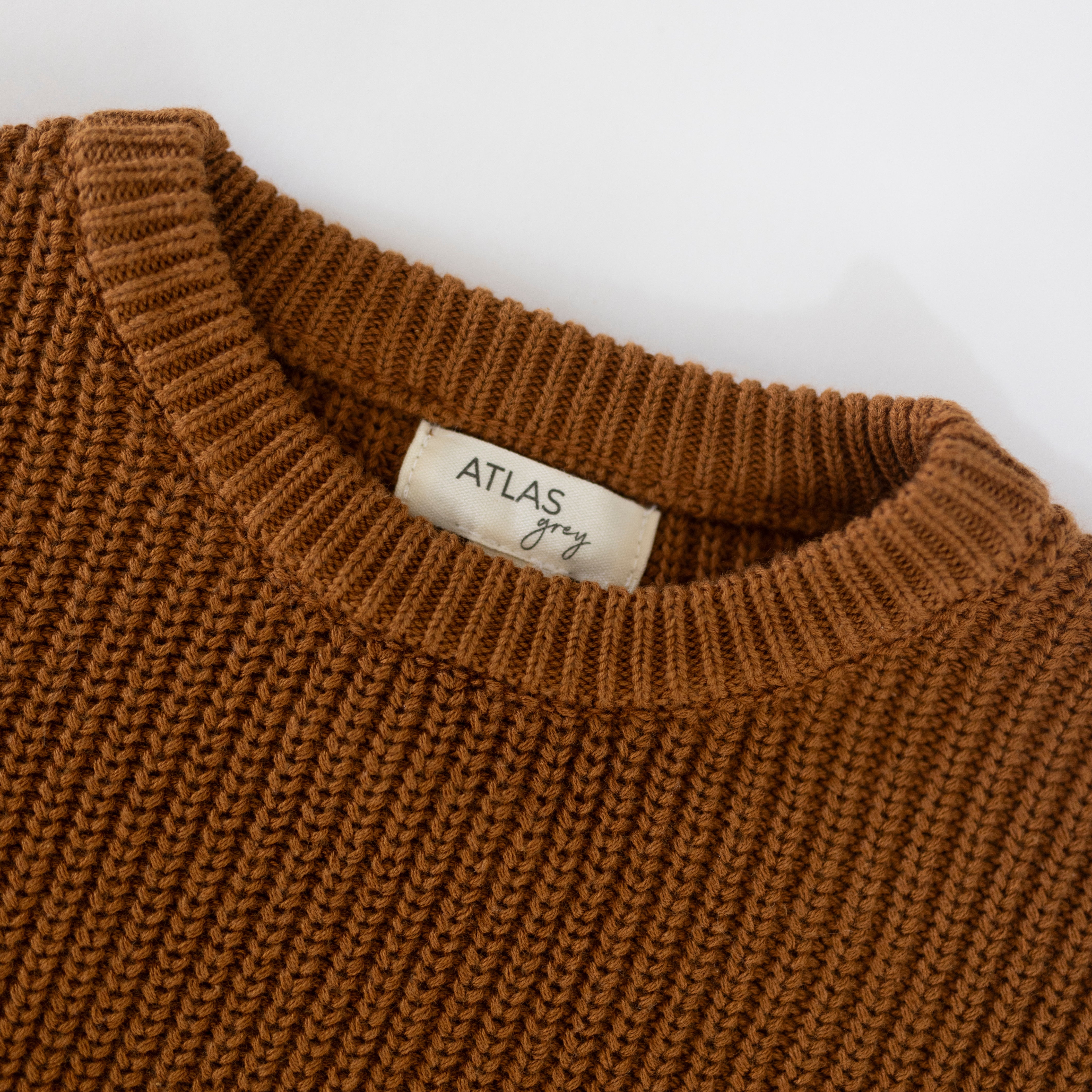 Organic Chunky Knit Sweater in rich brown color, showcasing a cozy knit texture, perfect for baby and kids.