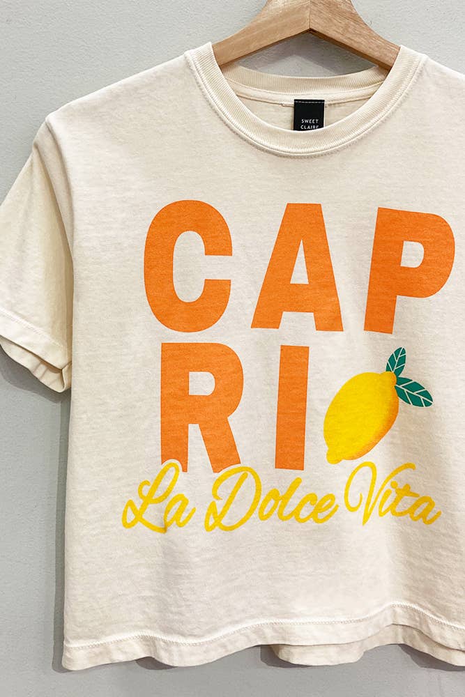 Capri cropped tee with bold orange lettering and lemon graphic, perfect for casual street style.