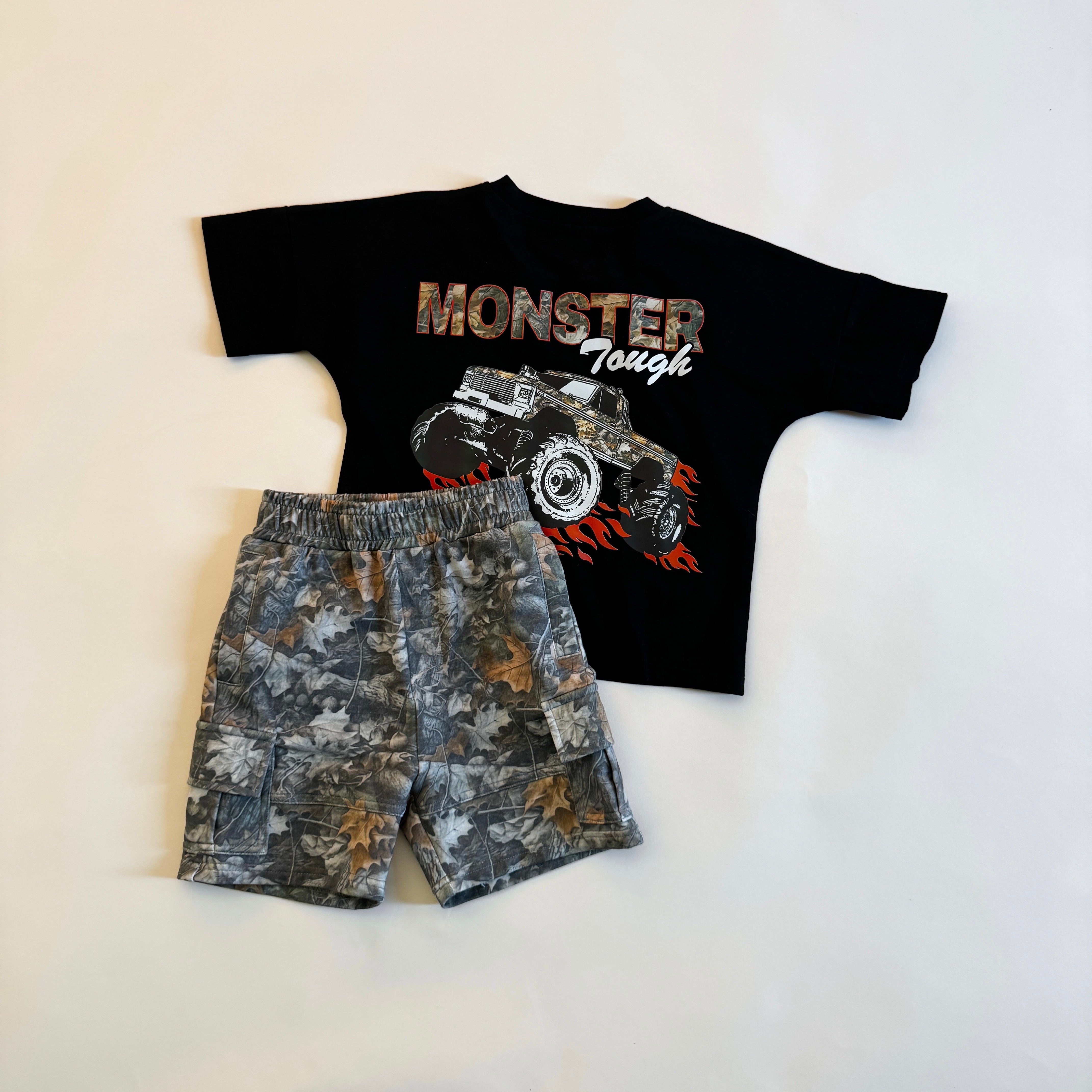 Boys' leaf camo cargo shorts and monster truck graphic tee for kids, perfect for outdoor adventures.