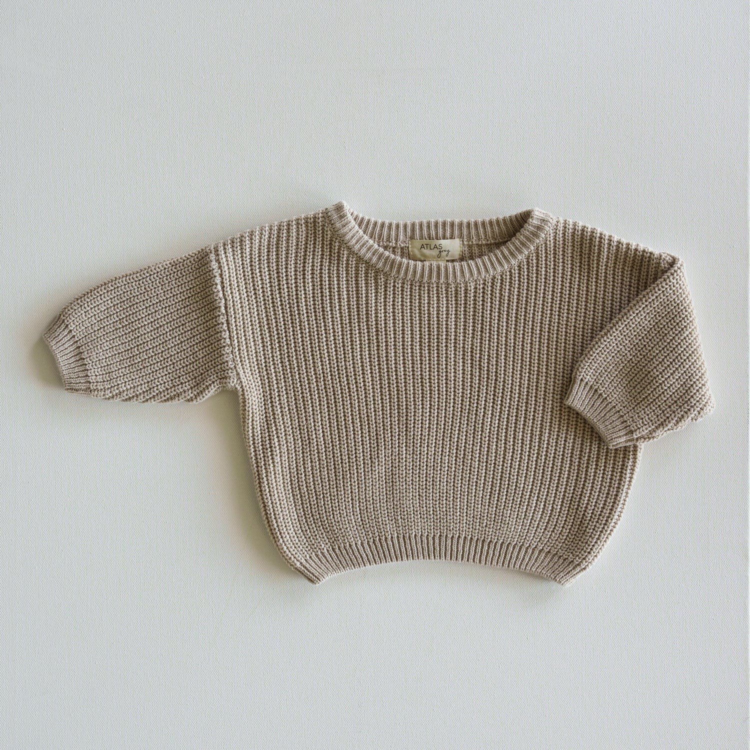 Organic Chunky Knit Sweater in a light beige color, made from 100% organic cotton, perfect for babies and kids.