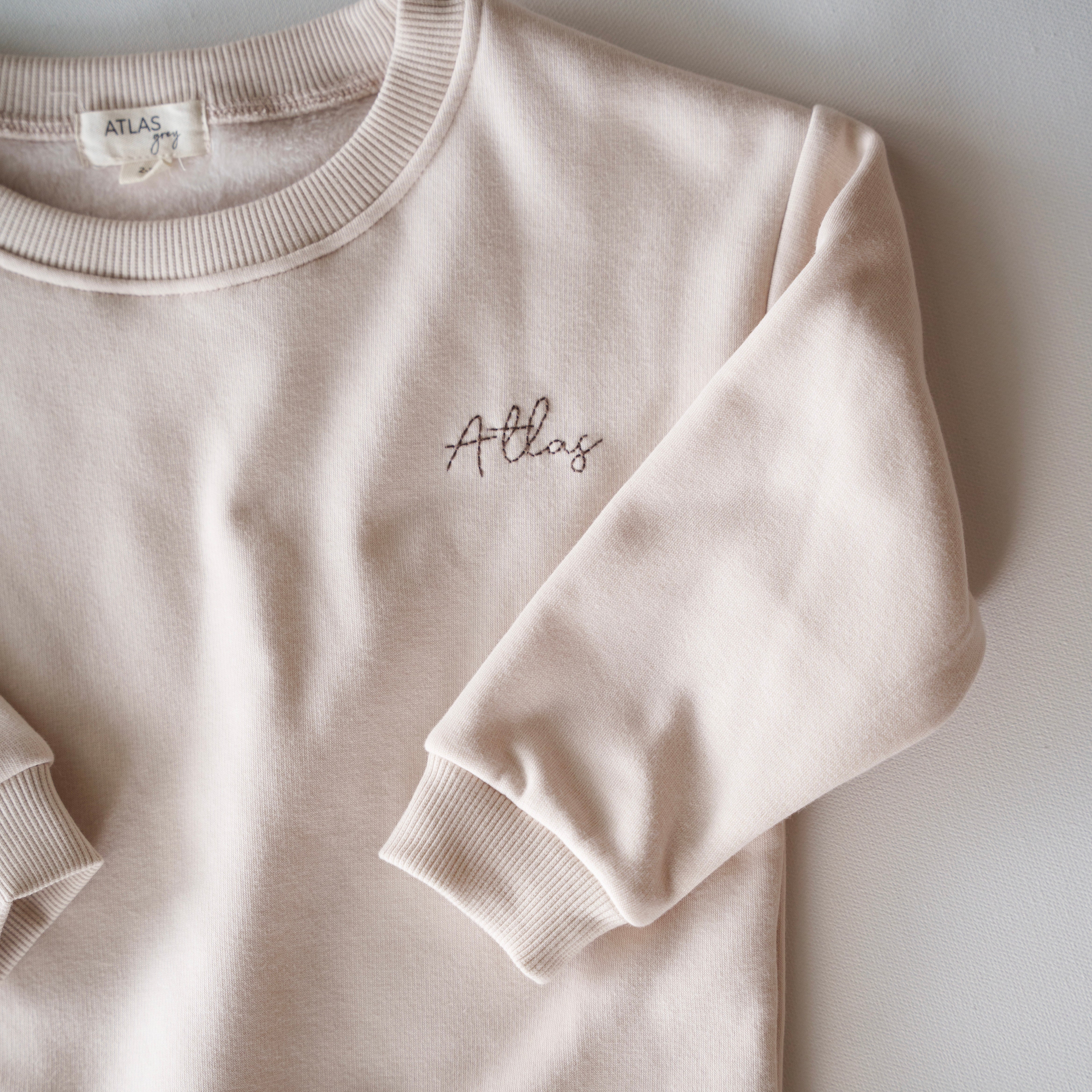 Fleece Sweat Set - Ultra-Soft Neutral Lounge Set featuring cozy beige fabric and embroidered logo.