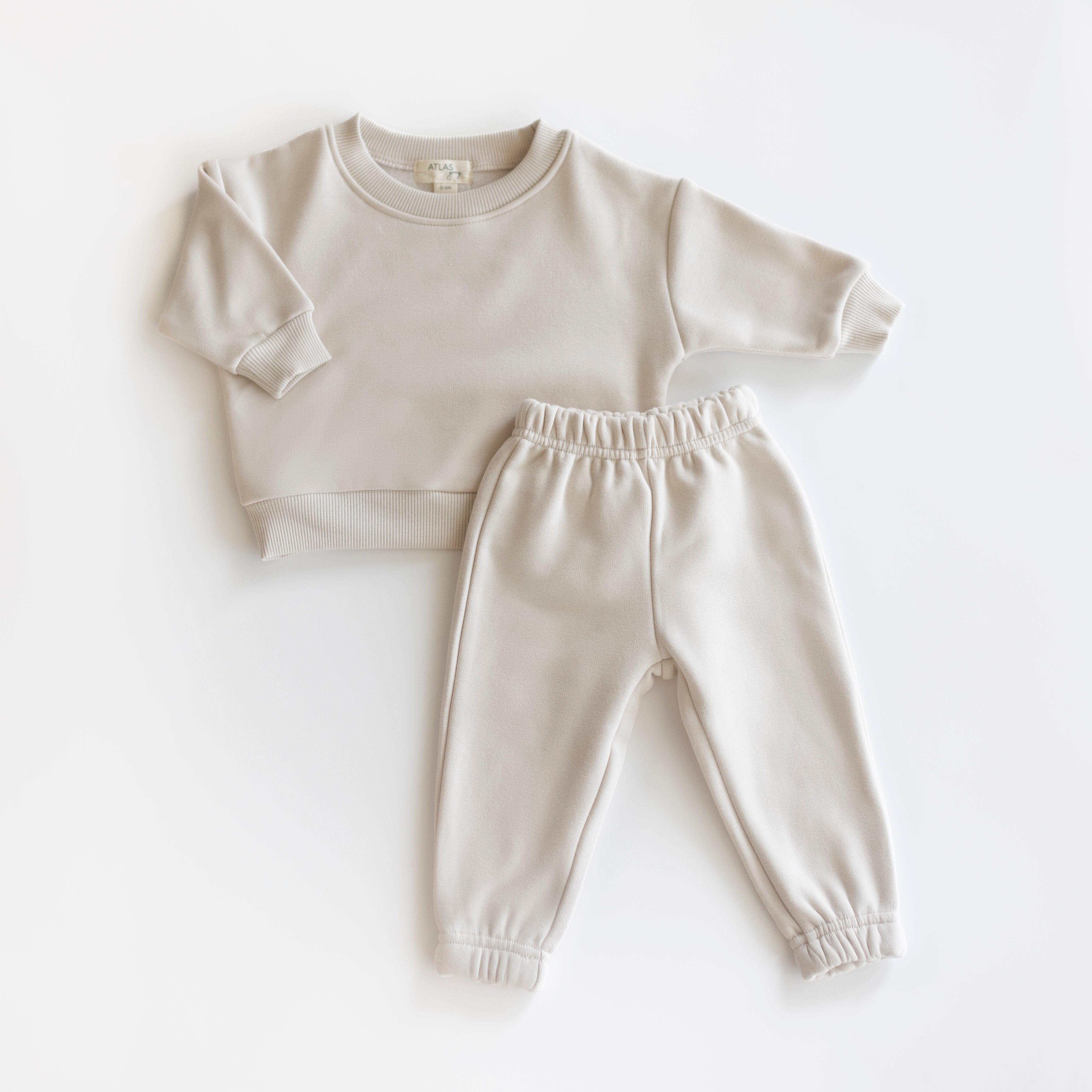 Fleece Sweat Set - Ultra-Soft Neutral Lounge Set featuring a cozy sweatshirt and pants in a light neutral color.
