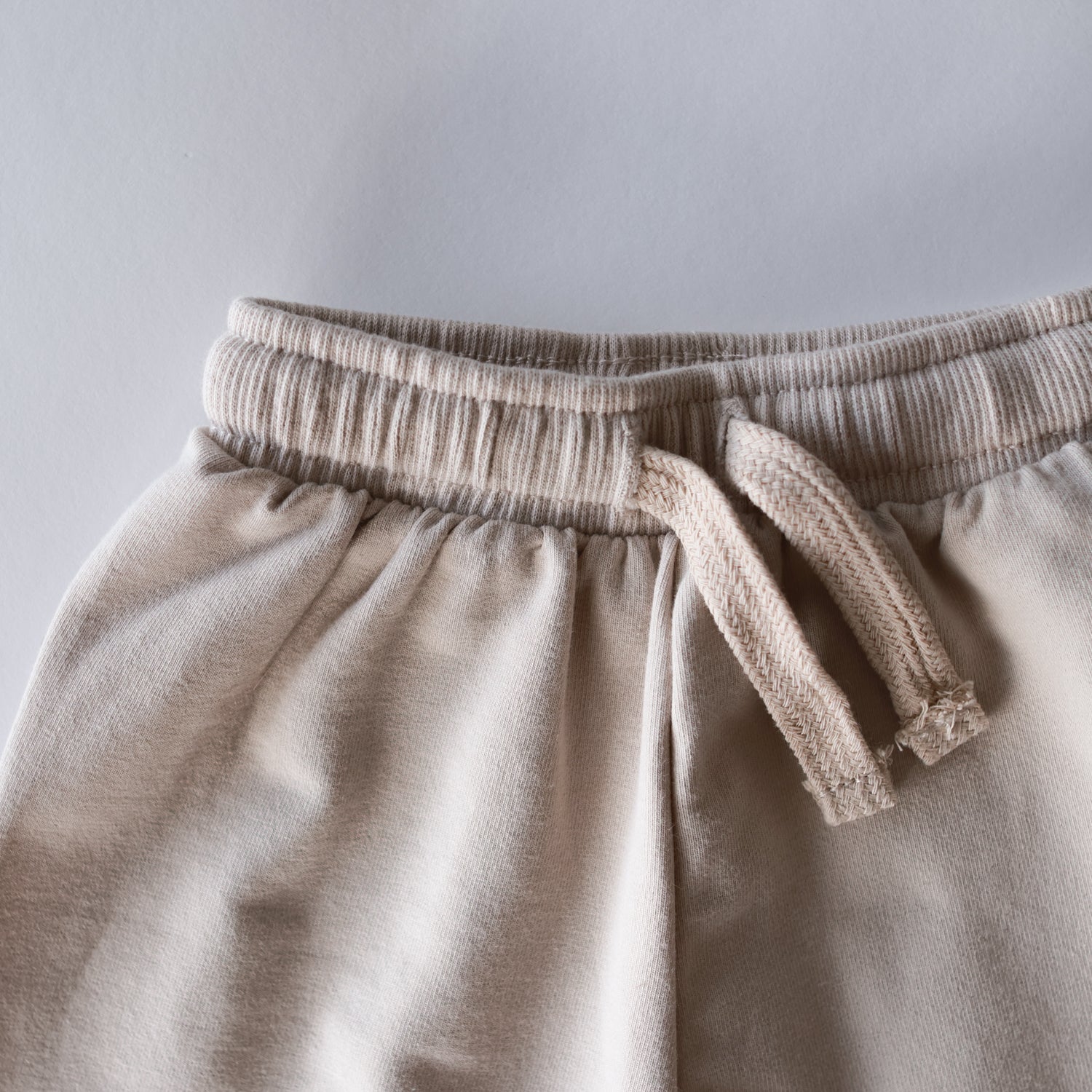 Oversized Sweatpant waistband detail showing soft fabric and drawstring for babies and kids.
