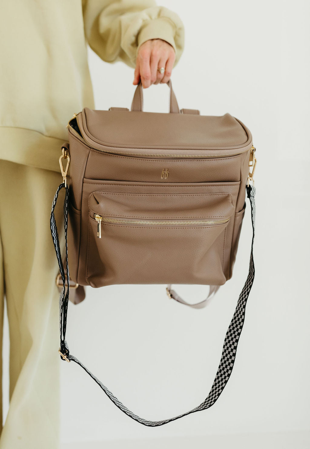 ff diaper bag taupe in vegan leather, featuring a removable shoulder strap and stylish design for everyday use.