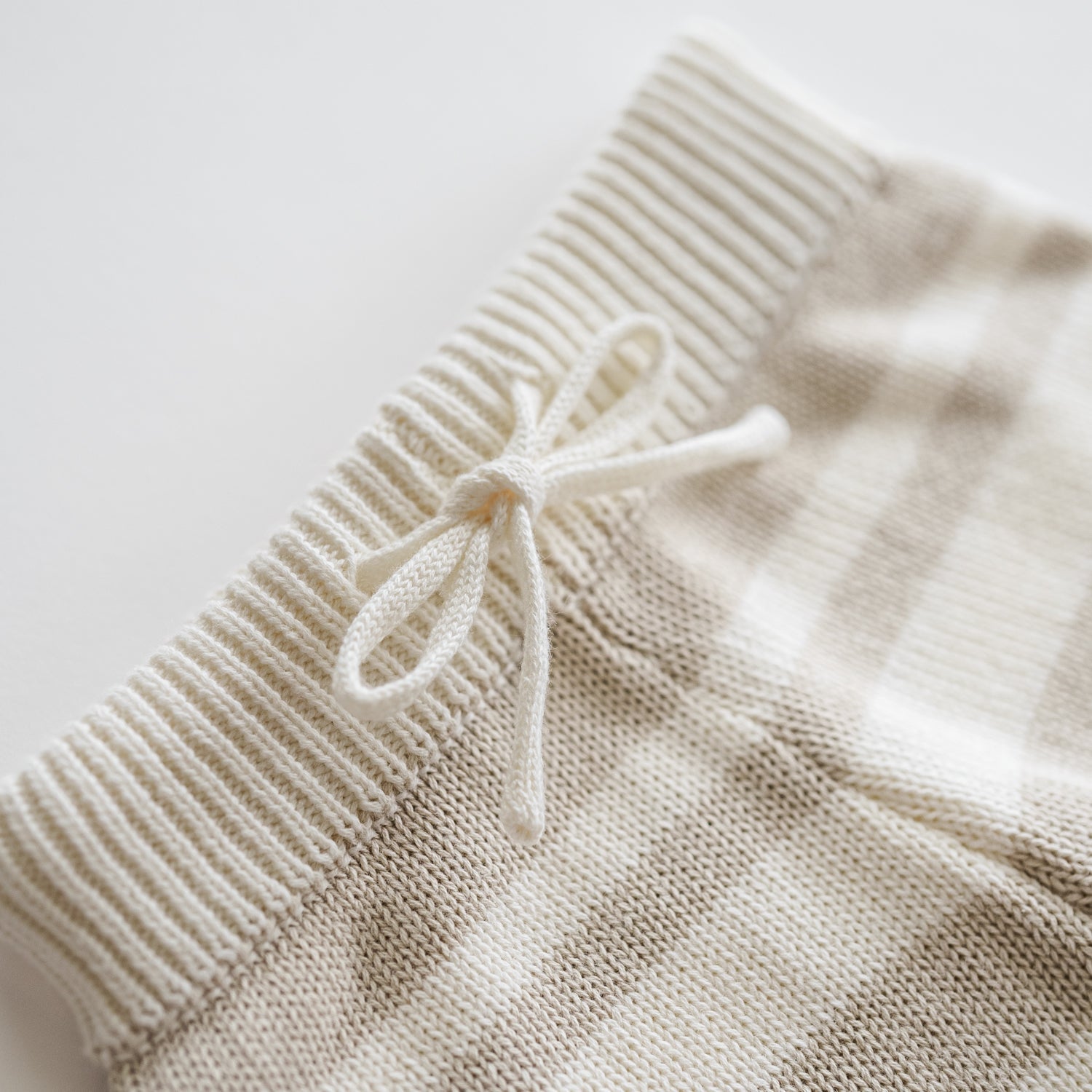 Detail of the Organic Knit Wideleg Pant with a soft elastic waistband and woven stripe pattern.