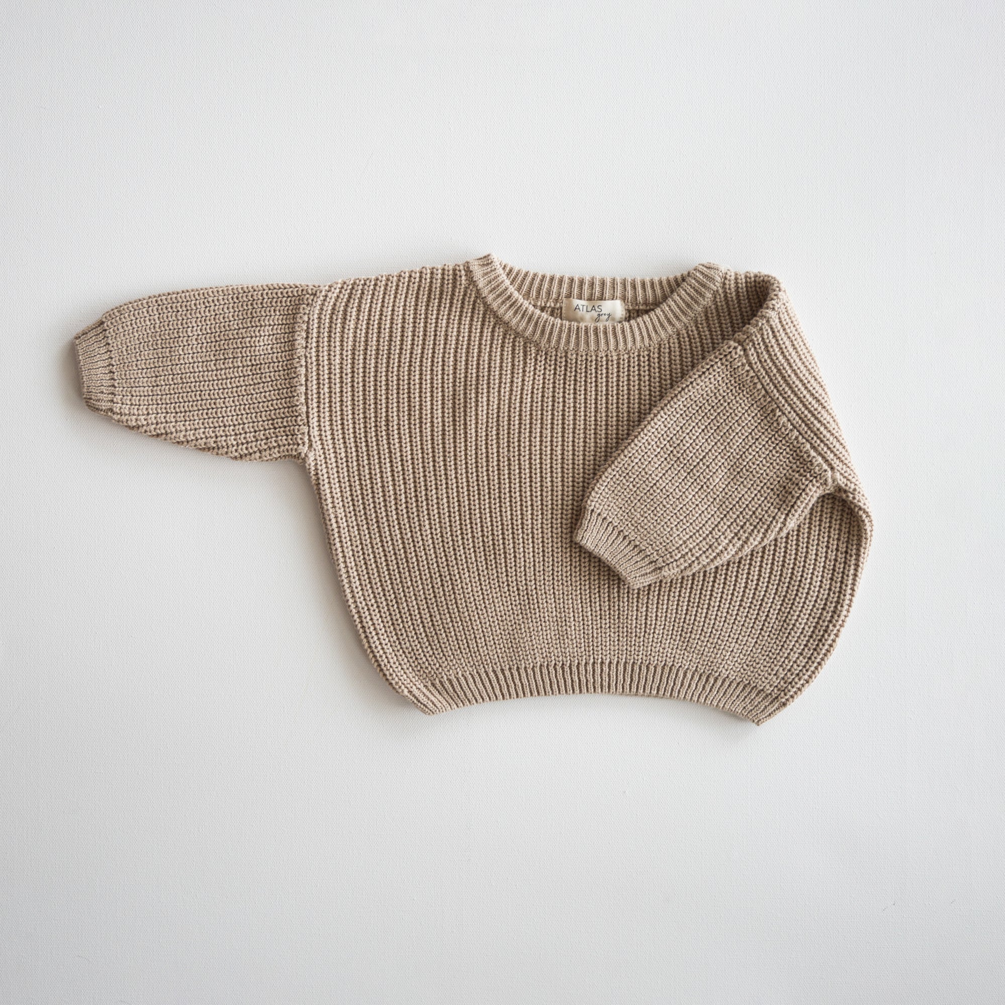 Organic Chunky Knit Sweater in a soft tan color, perfect for babies and kids, made of 100% organic cotton.