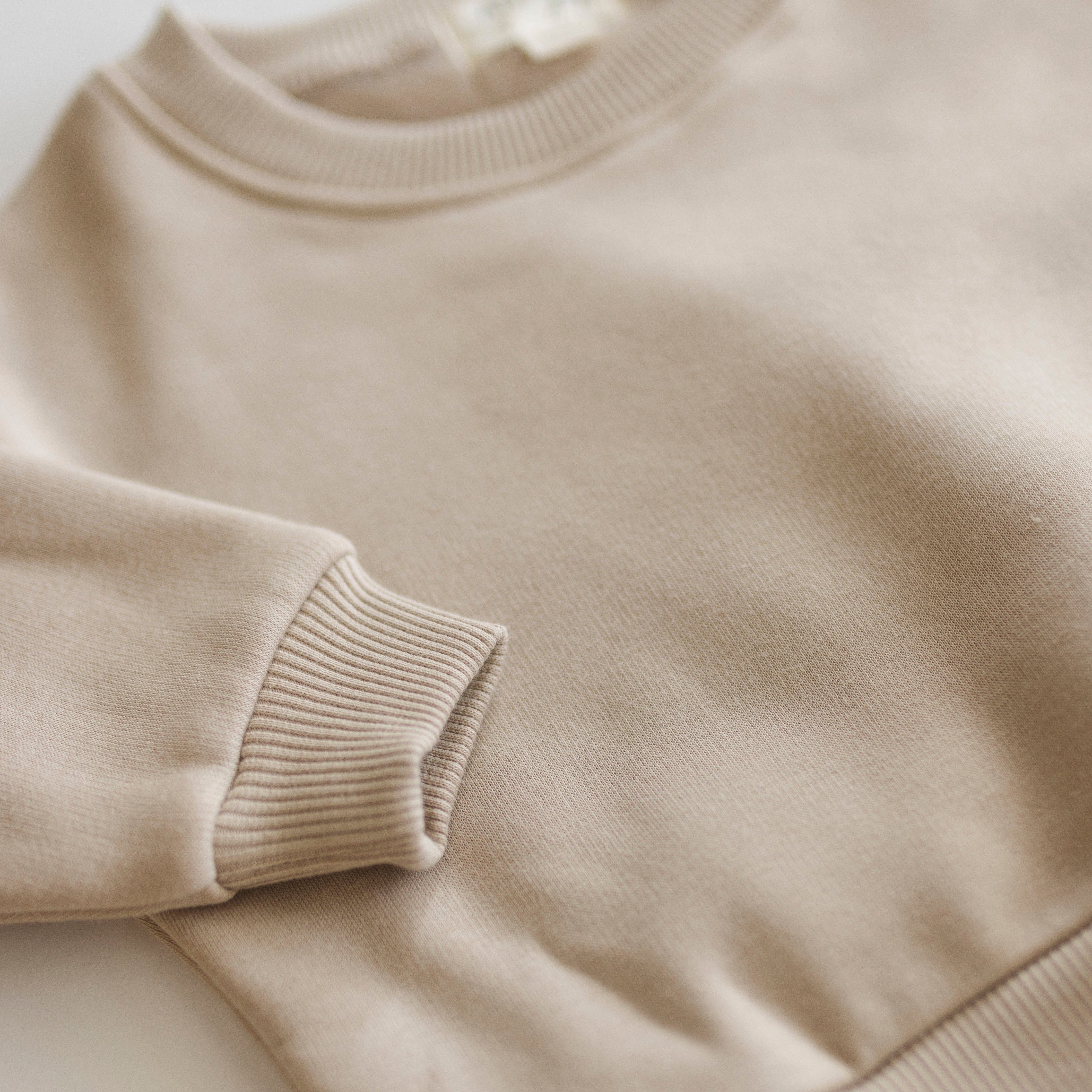 Fleece Sweat Set - close-up of the ultra-soft neutral lounge set showcasing cozy fabric and ribbed cuffs.
