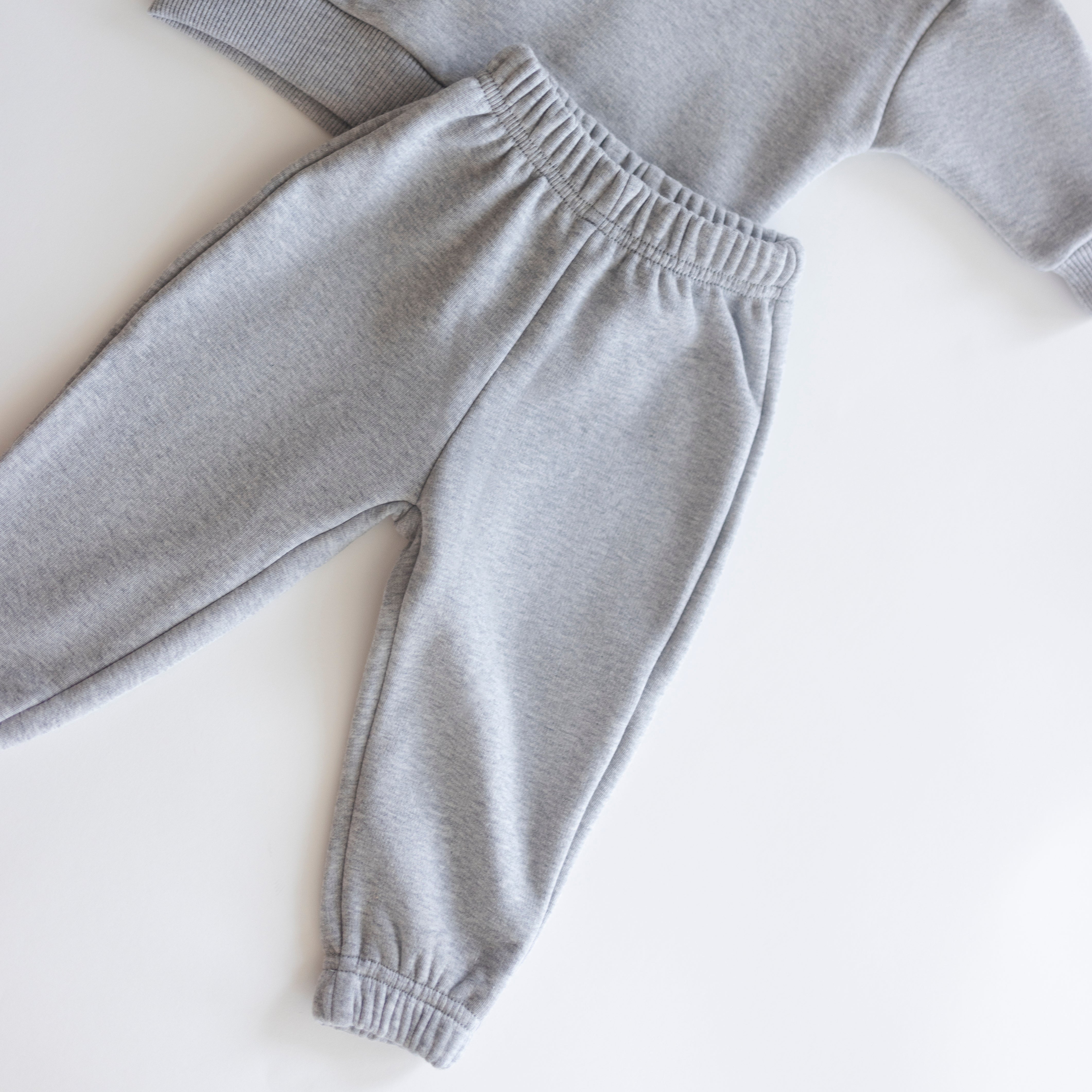 Fleece Sweat Set featuring a cozy grey top and comfortable sweatpants for relaxed lounge wear.