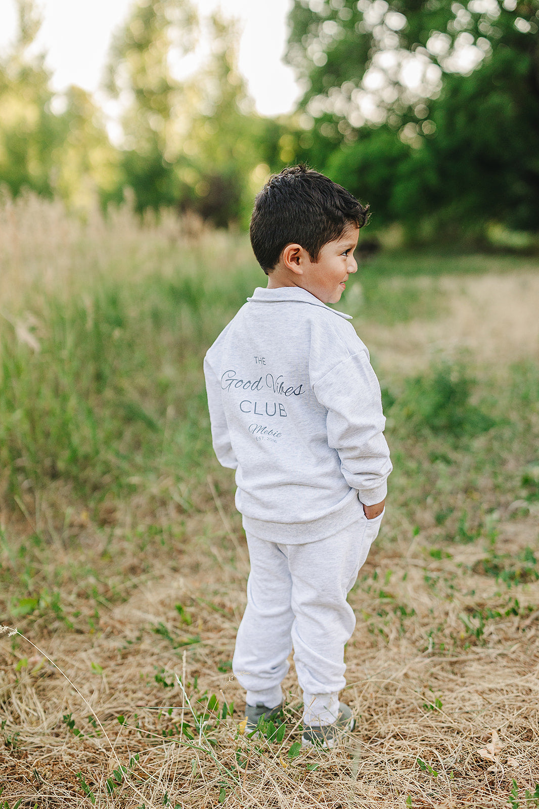 Unisex French terry school outfit for kids, featuring a half-zip sweatshirt and joggers in a neutral tone.