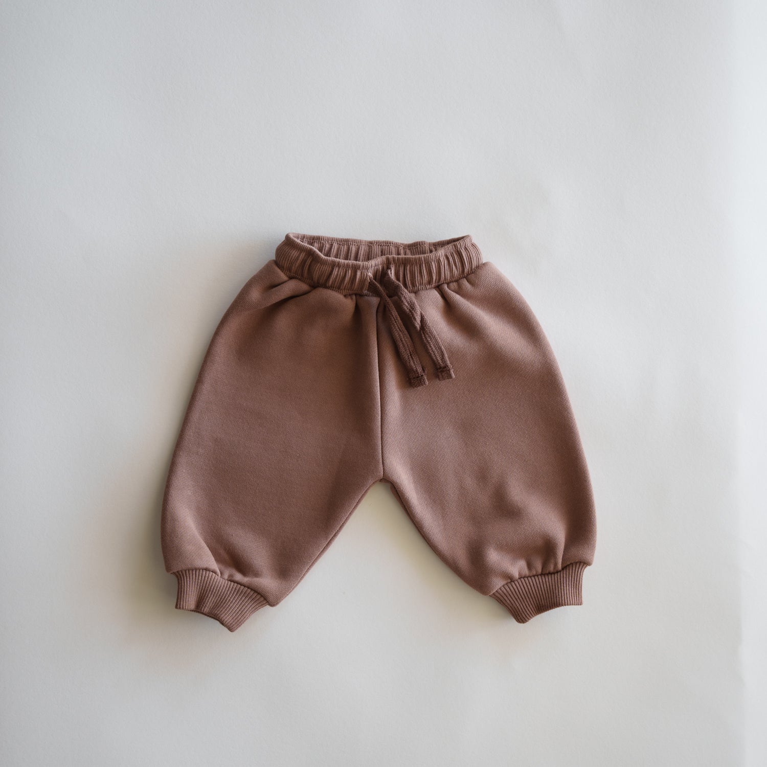 Oversized Sweatpant in soft pink, perfect cozy bottoms for babies and kids, ideal for relaxed playtime.