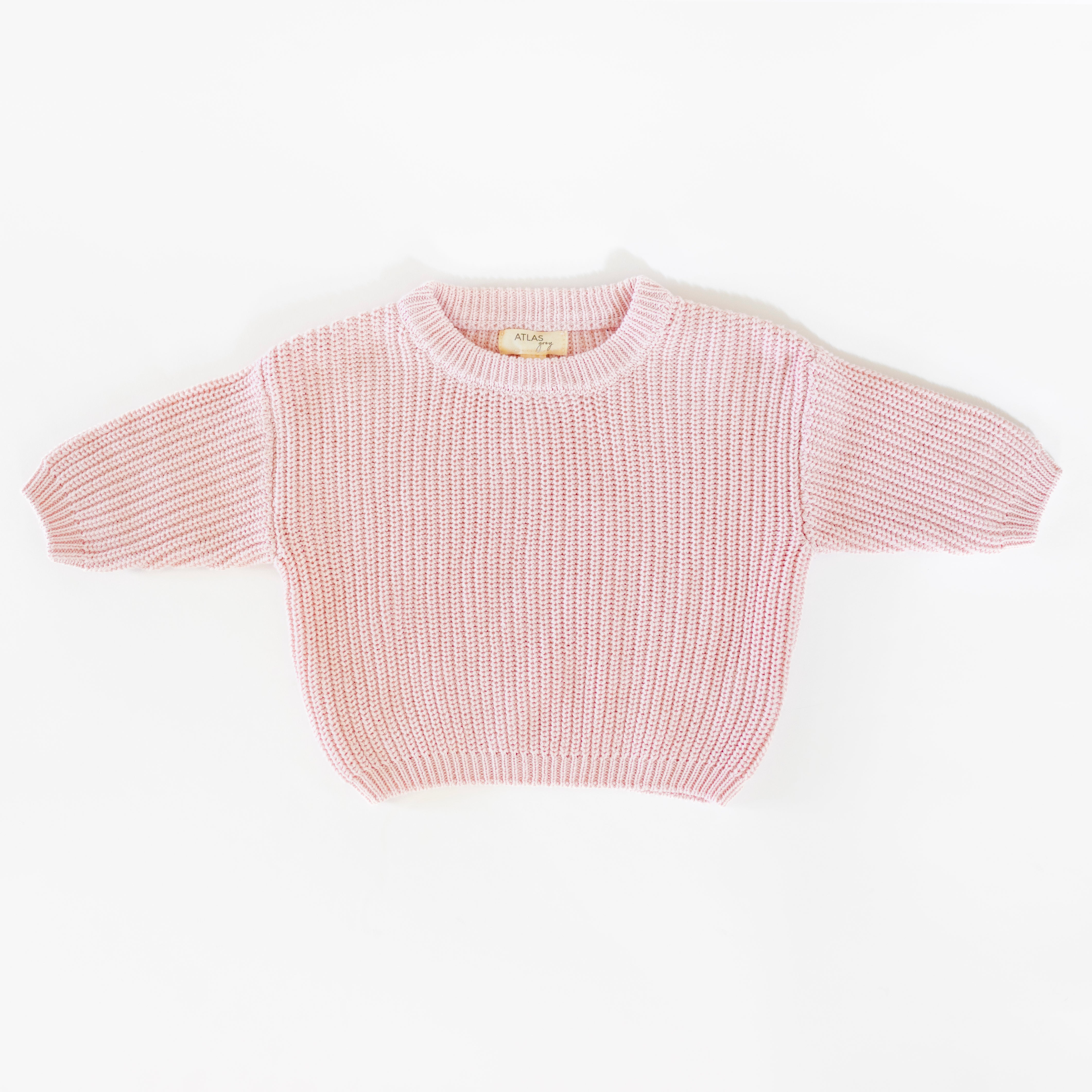 Organic Chunky Knit Sweater in soft pink color for babies and kids, made from 100% organic cotton.