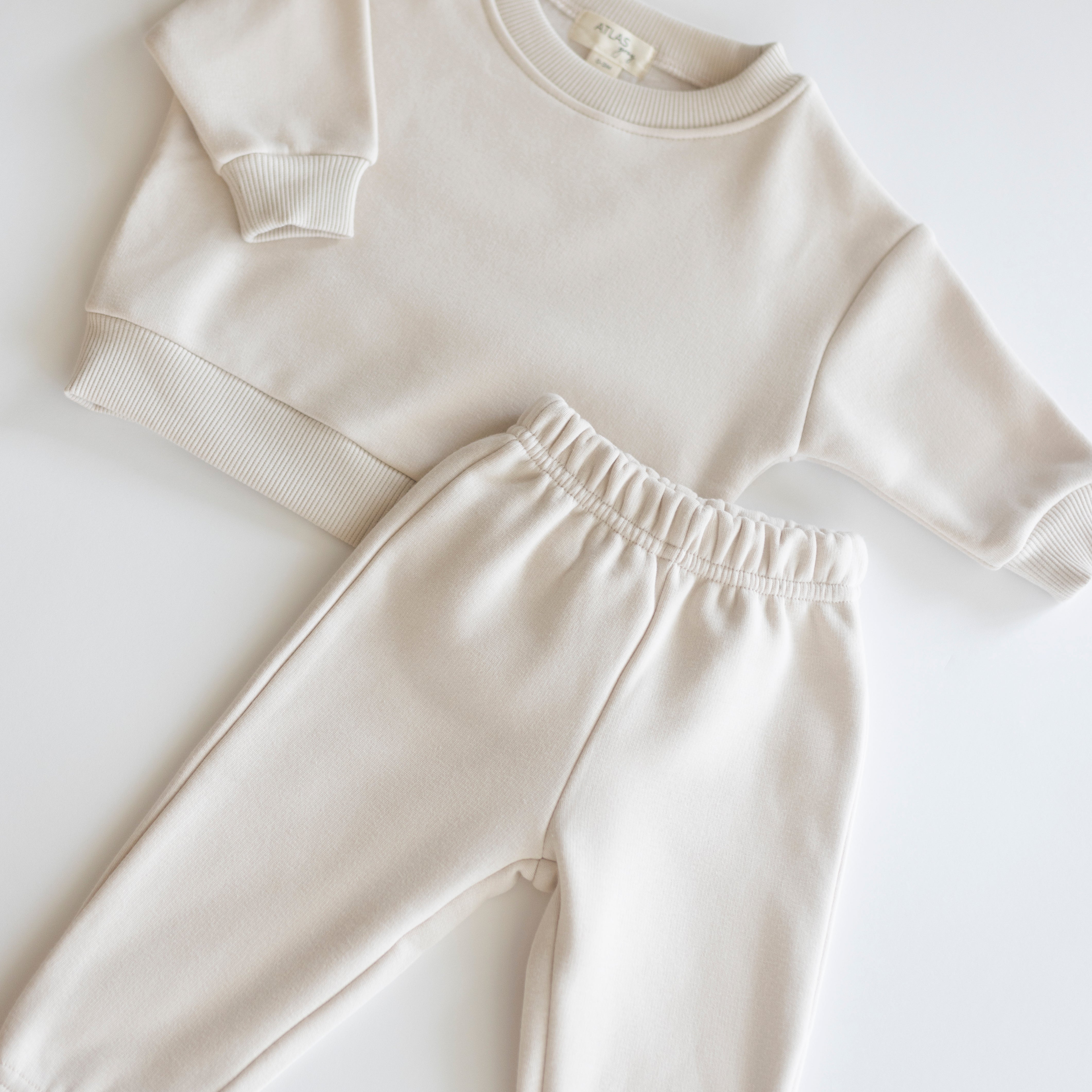 Fleece Sweat Set - Ultra-Soft Neutral Lounge Set in cream color, featuring a cozy sweatshirt and pants.