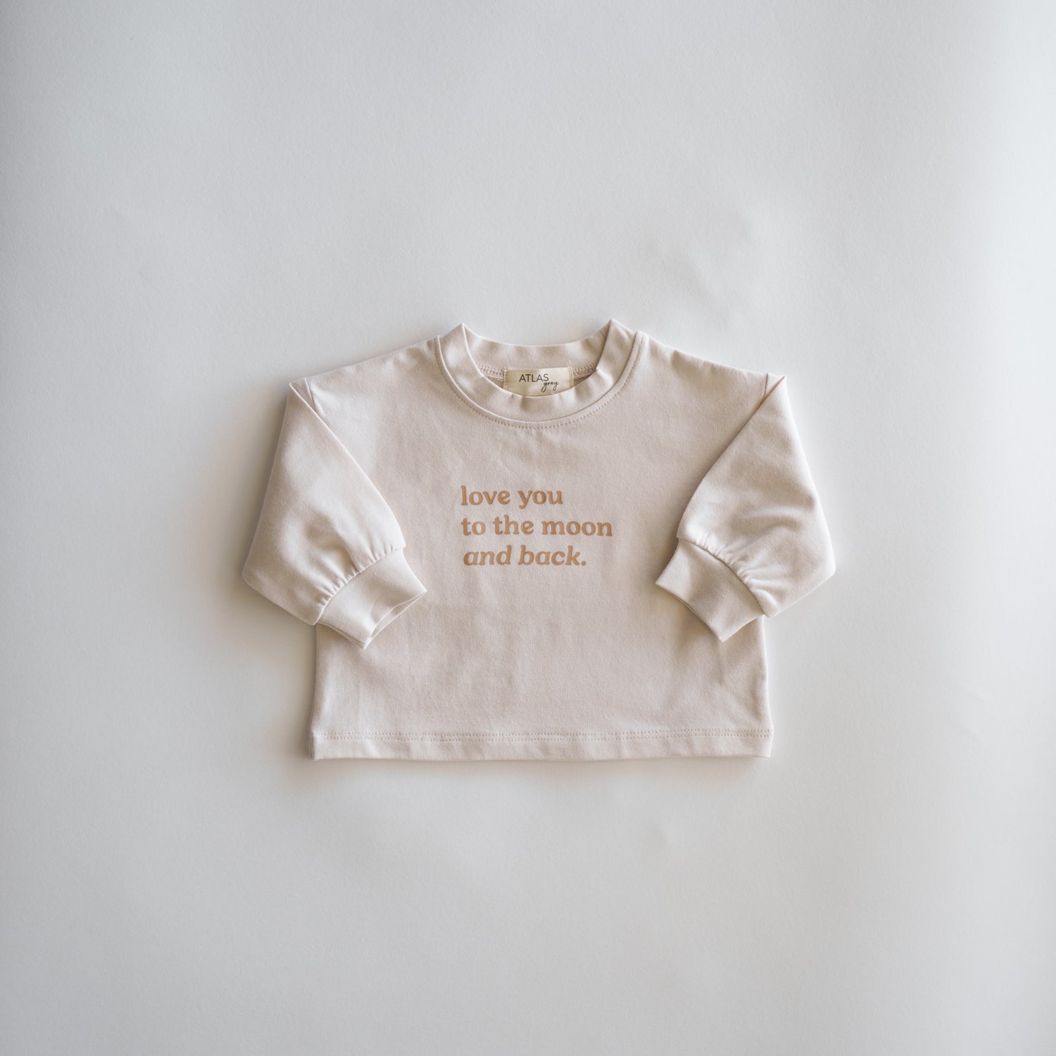 Love You to the Moon and Back Organic Longsleeve featuring a cute message on a soft cotton top.