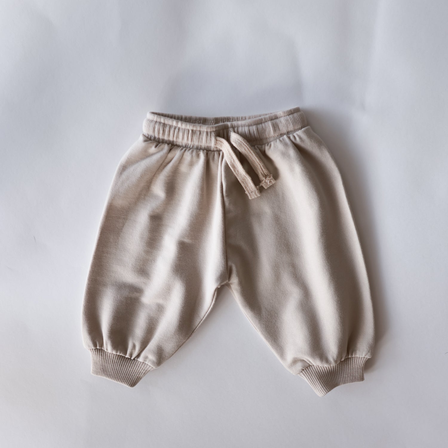 Oversized Sweatpant in soft neutral tone, perfect for cozy days for babies and kids.