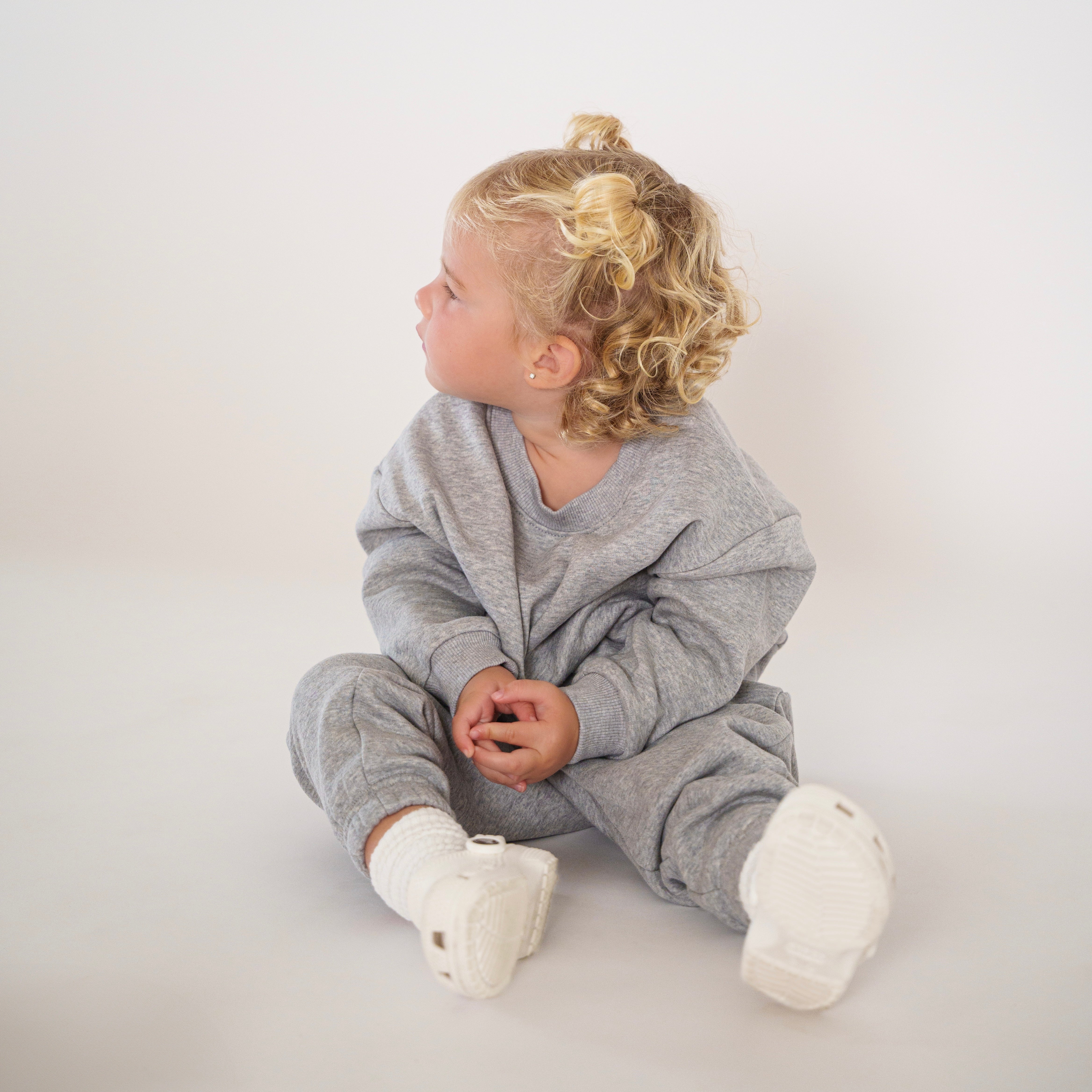 Fleece Sweat Set - Ultra-Soft Neutral Lounge Set worn by a child sitting and looking to the side.