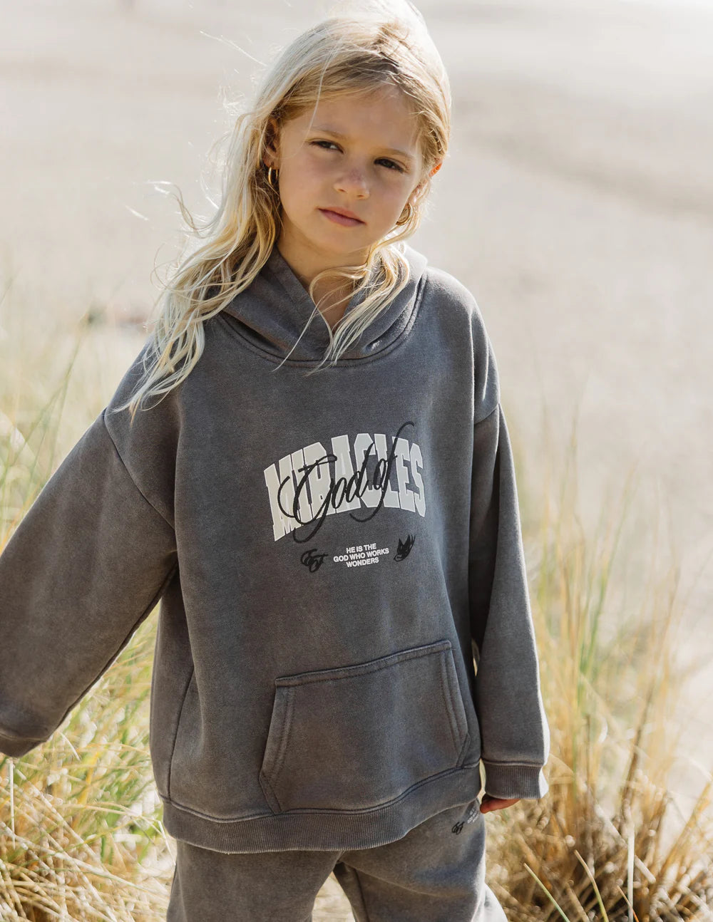 God of Miracles kids hoodie in oversized fit, perfect for playground or lounging, featuring stylish embroidery and cozy design.